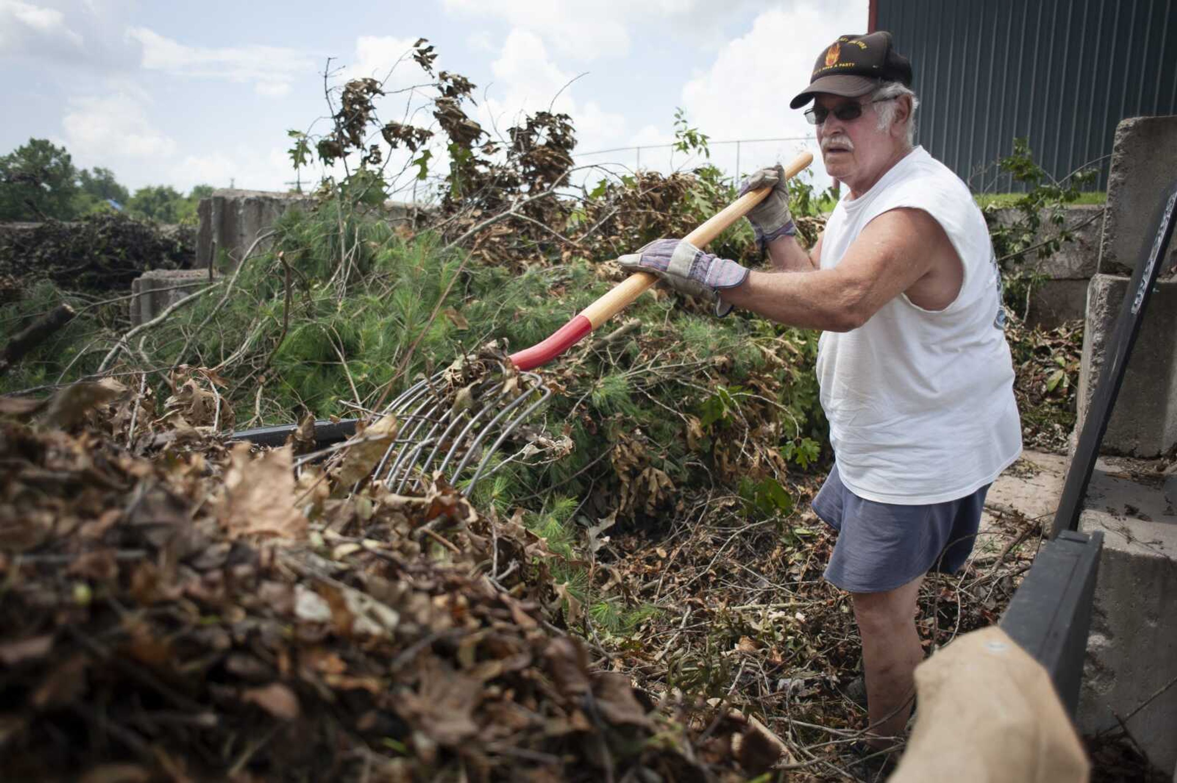 Richard Bazzell of Jackson unloads debris left from the June 21 storm Monday near the Jackson Recycling Center at 508 Eastview Court in Jackson. He said he had some tree damage from the storm and a large limb that landed on his house. Bazzell said the city collected debris that had been stacked along the curb. "This was a lot of sticks and leaves and stuff all mixed together," he said of Monday's load. "We're just picking up what~s left of it."