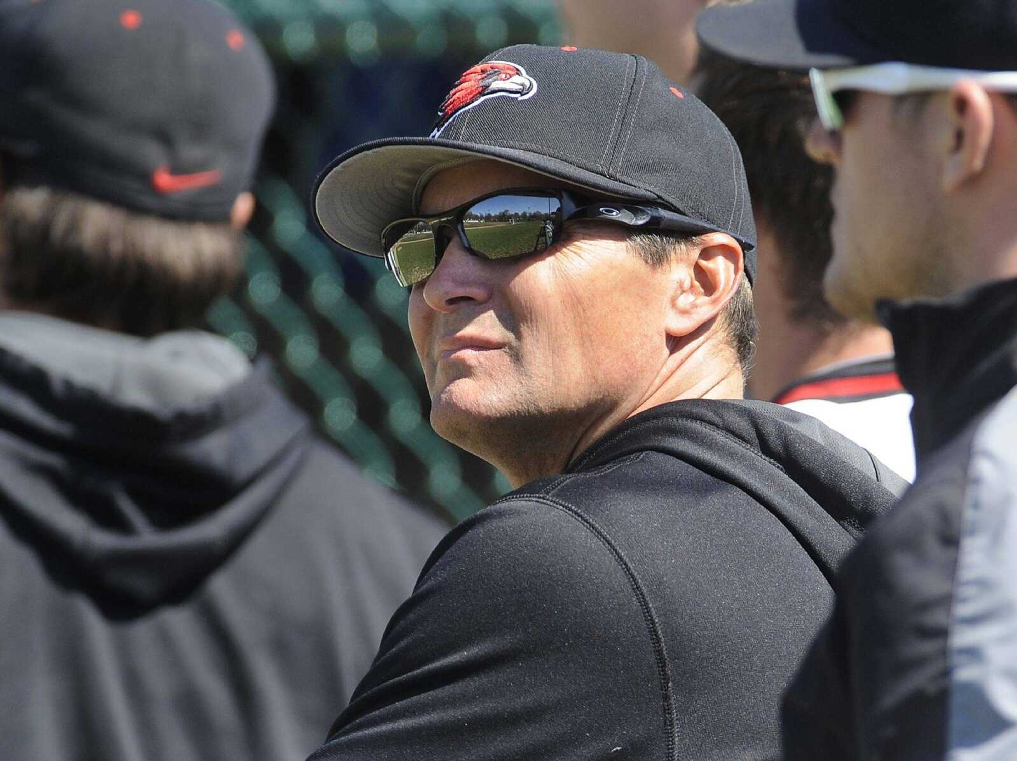 Southeast Missouri State coach Steve Bieser watches a game from the dugout earlier this season at Capaha Field. Bieser led the Redhawks to their third consectuive OVC regular-season title this year.