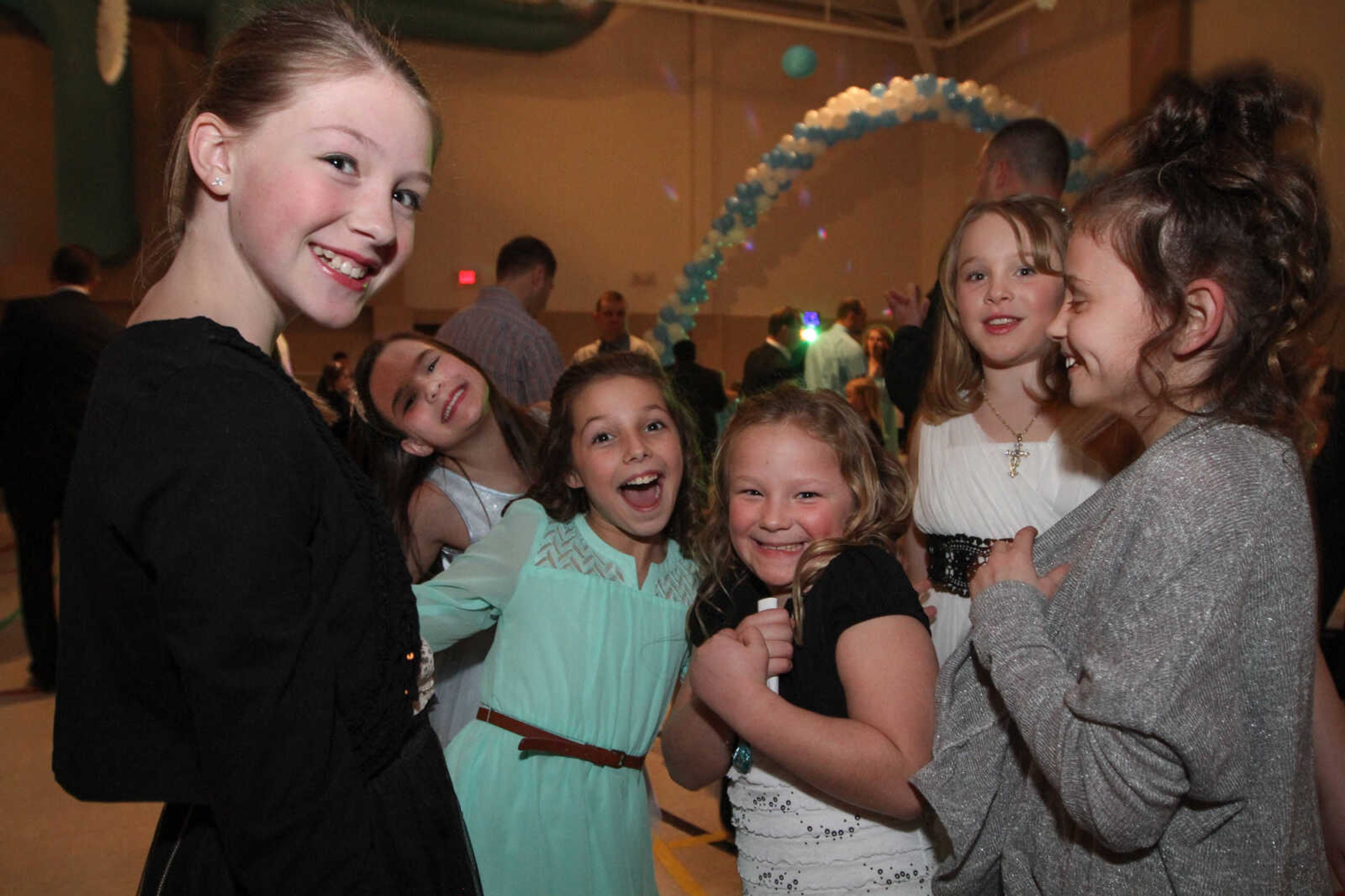 GLENN LANDBERG ~ glandberg@semissourian.com


A group of girls take a break from dancing with their fathers during the 7th annual Father/Daughter Dance Saturday, Feb. 21, 2015 at the Osage Centre.