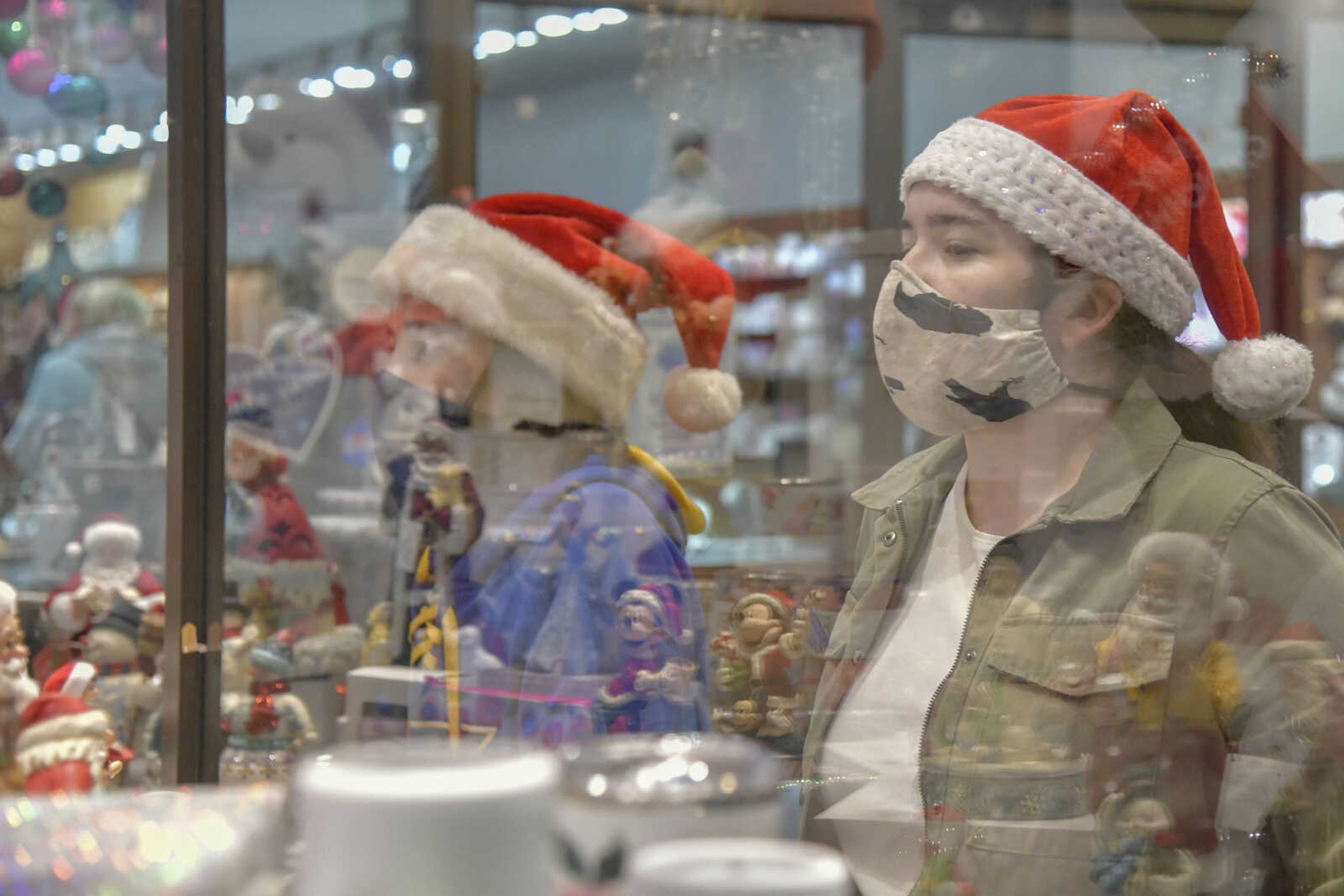 (From left) Finn Gorman and Libby Gorman look at the Christmas window display at ZickField's during the Downtown Christmas Open House in Cape Girardeau on Friday, Dec. 4, 2020.