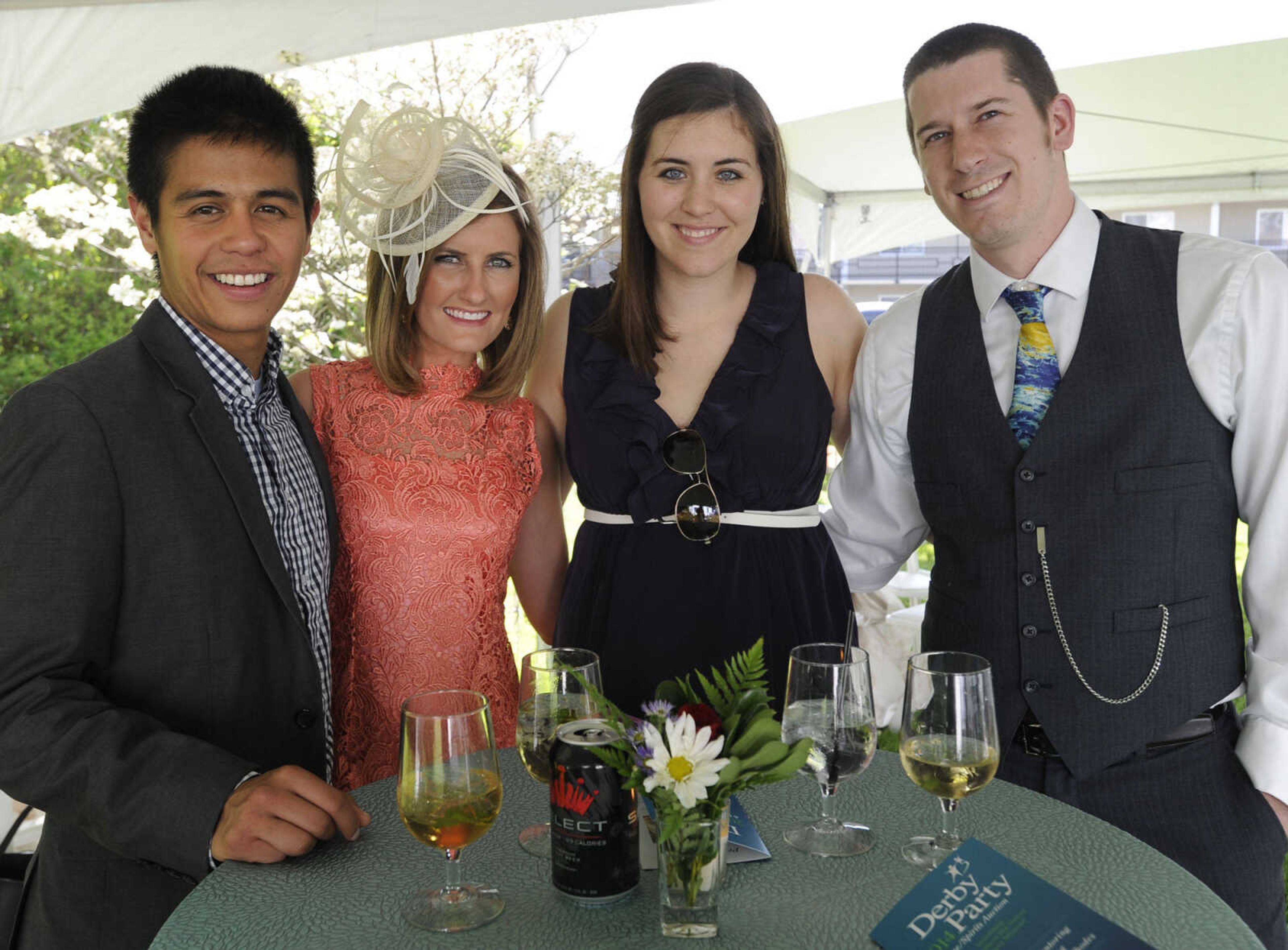 Lisandro Fabellar, left, Devon Cramer, Lauren Nosal and Chris Nosal pose for a photo at the Derby Party fundraiser for Big Brothers Big Sisters of Eastern Missouri on Saturday, May 3, 2014 at the Glenn House in Cape Girardeau.