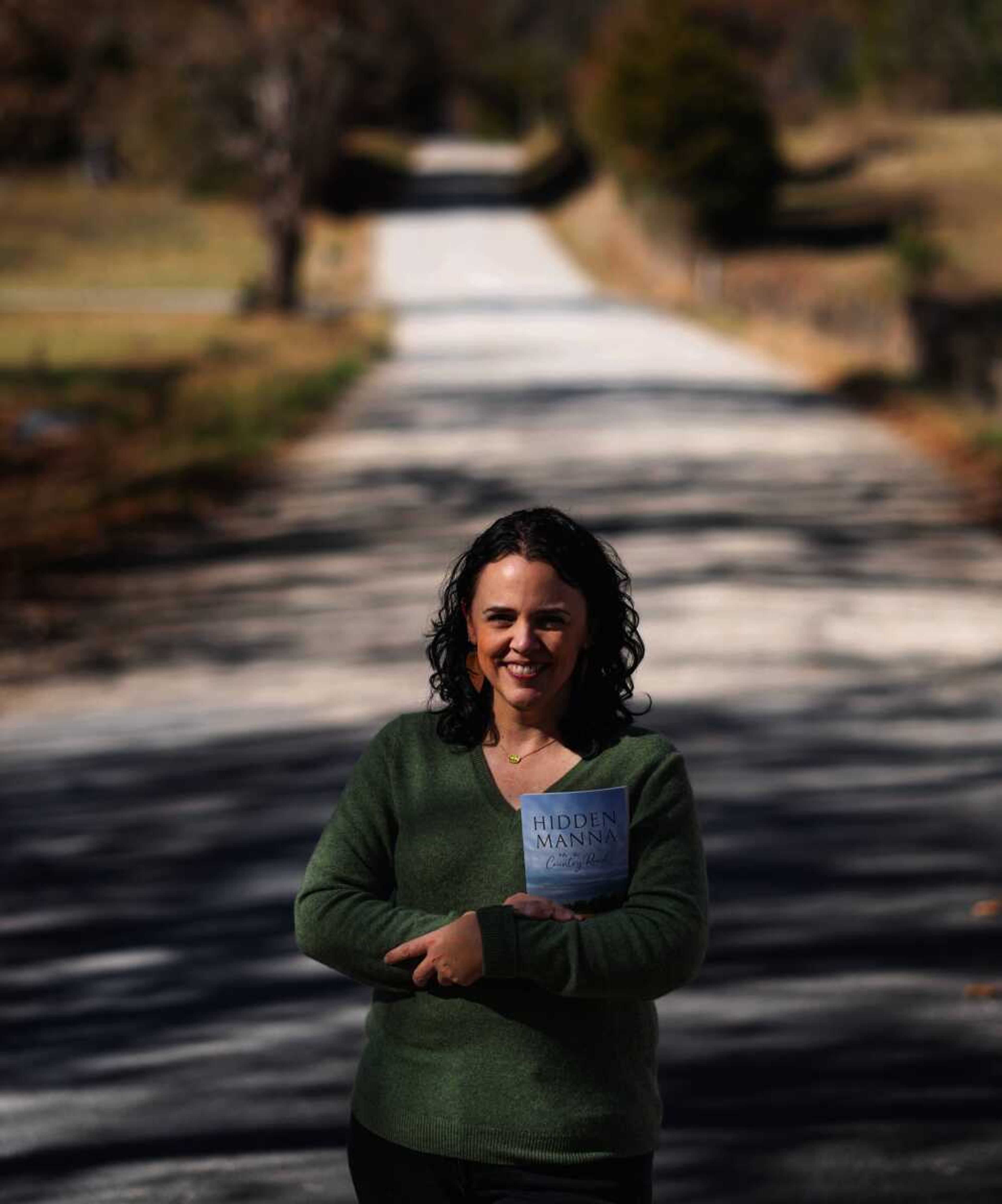 Sarah Geringer, author of the book "Hidden Manna on a Country Road: Seeing God's daily provision all around us," stands on one of the gravel roads that inspired the book. The paperback version of the book released Nov. 1.