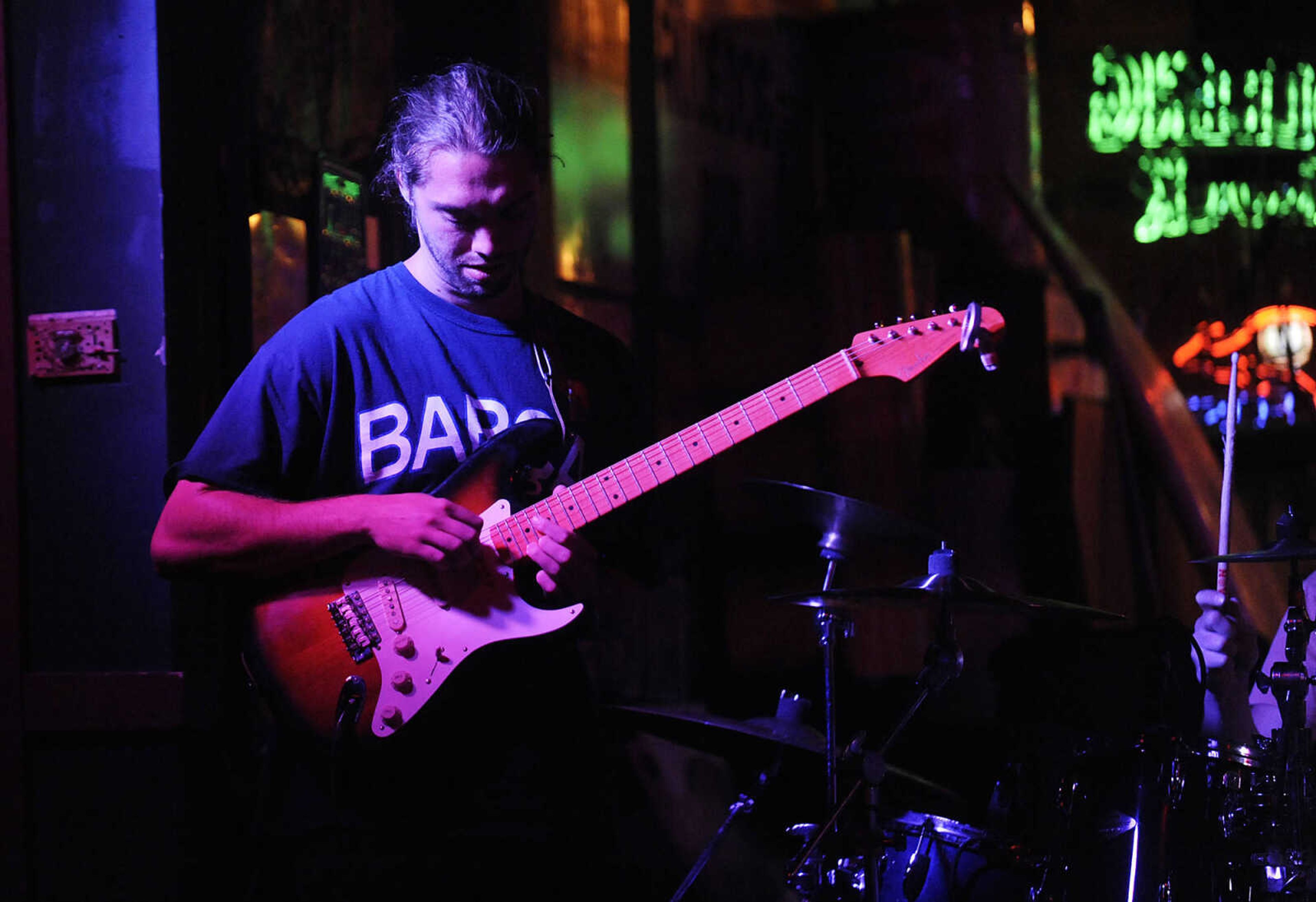 Zach Priester plays lead guitar during a performance by the Mike Renick Band at the Rude Dog Pub, 123 Main Street, Friday, June 22.