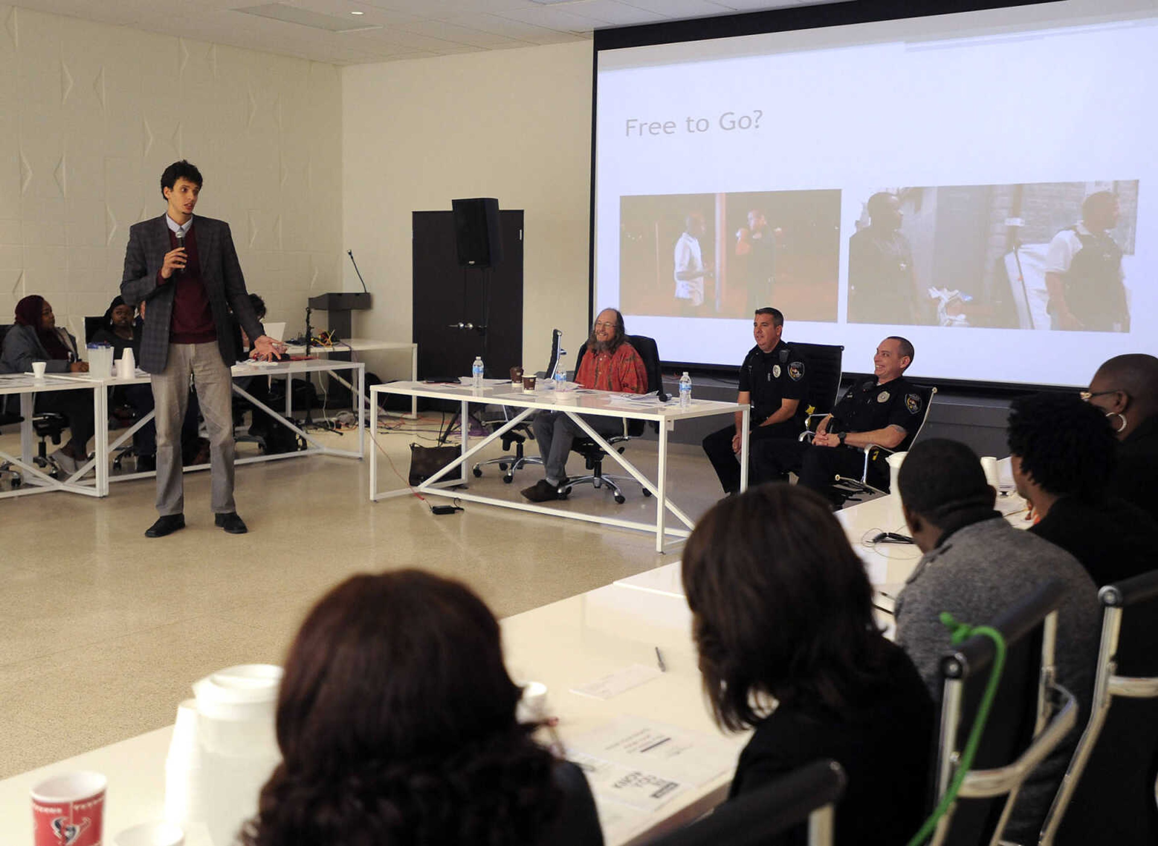 ACLU representative Mustafa Abdullah speaks at the Know Your Rights event Saturday, Feb. 20, 2016 at The Concourse.