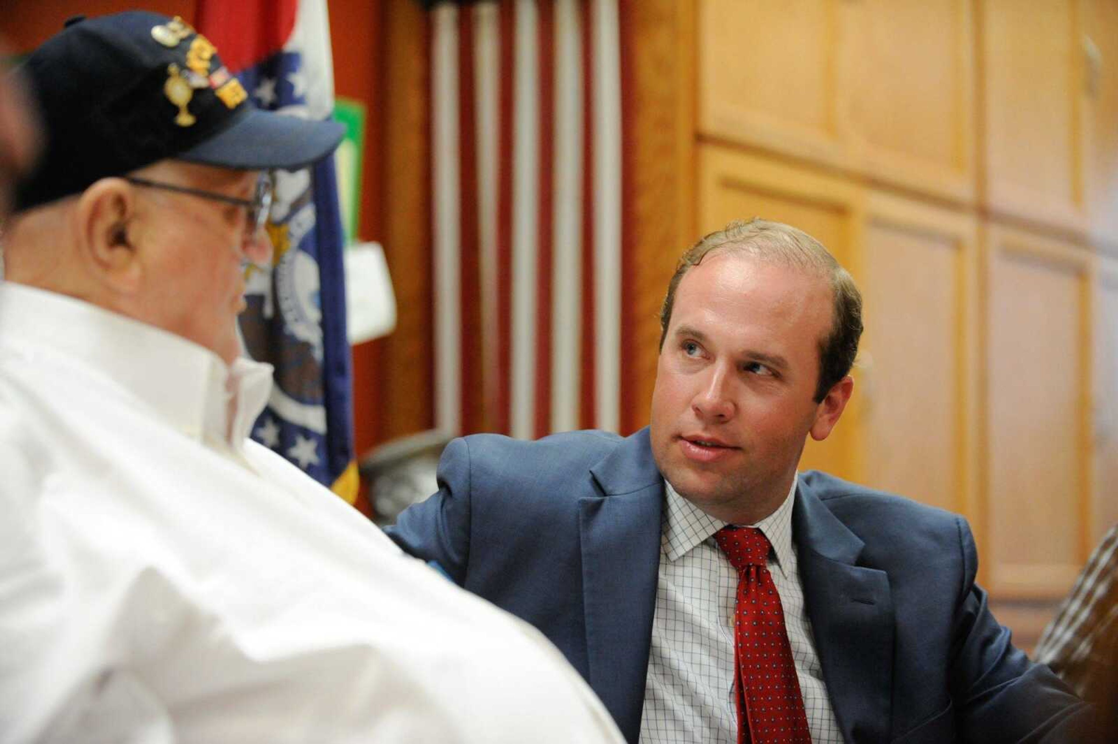 U.S. Rep. Jason Smith talks with Raymond Burbach on Wednesday after presenting him seven awards and accolades for his service in the Korean War at the Missouri Veterans Home in Cape Girardeau.