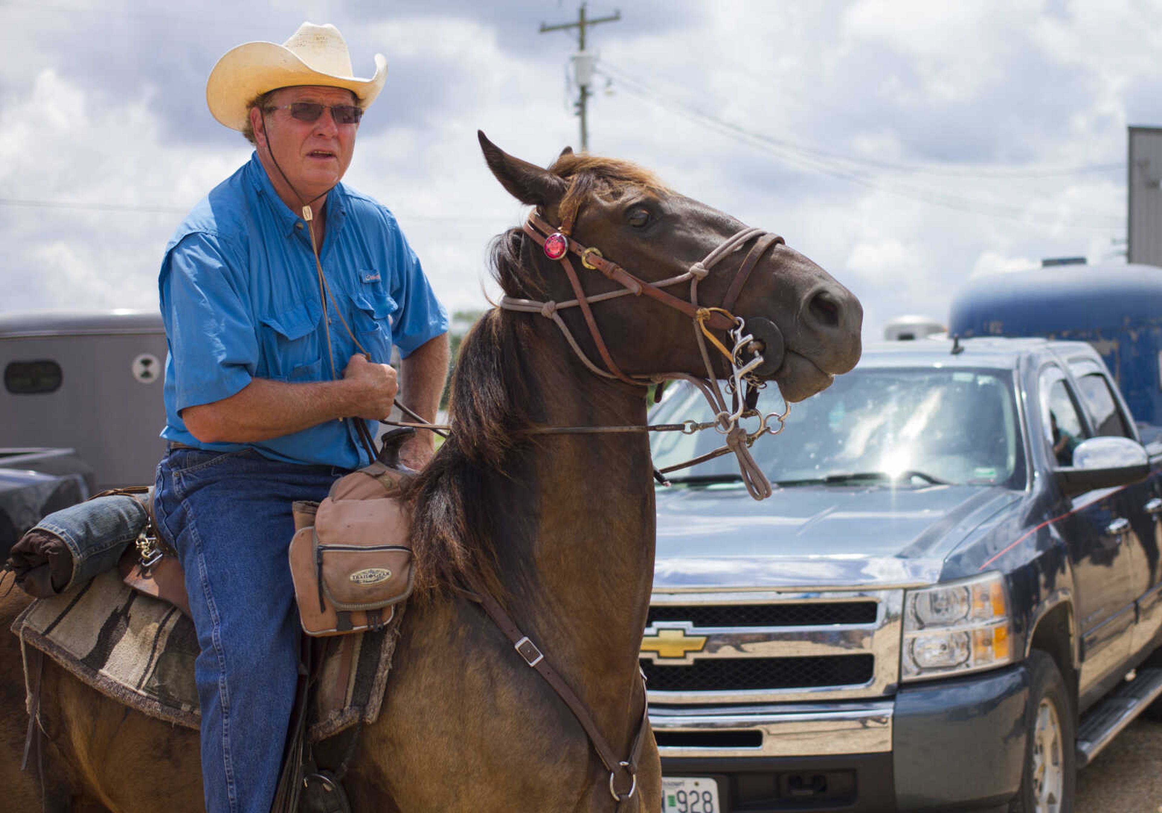 Ronnie Hyde saddles up for a trail ride sponsored by Jackson Trail Riders June 4, 2017, in Patton, Missouri.