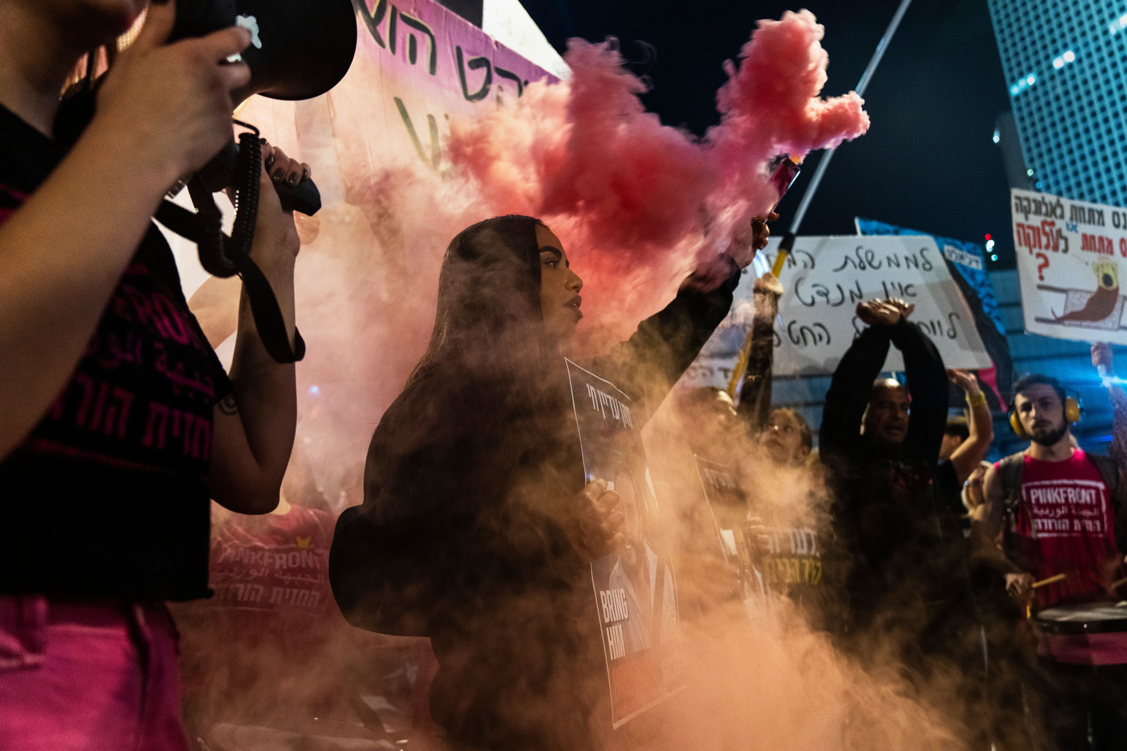 People shout slogans during a protest against Prime Minister Benjamin Netanyahu's government and call for the release of hostages held in the Gaza Strip by the Hamas militant group, in Tel Aviv, Israel, Saturday, Nov. 16, 2024. (AP Photo/Francisco Seco)