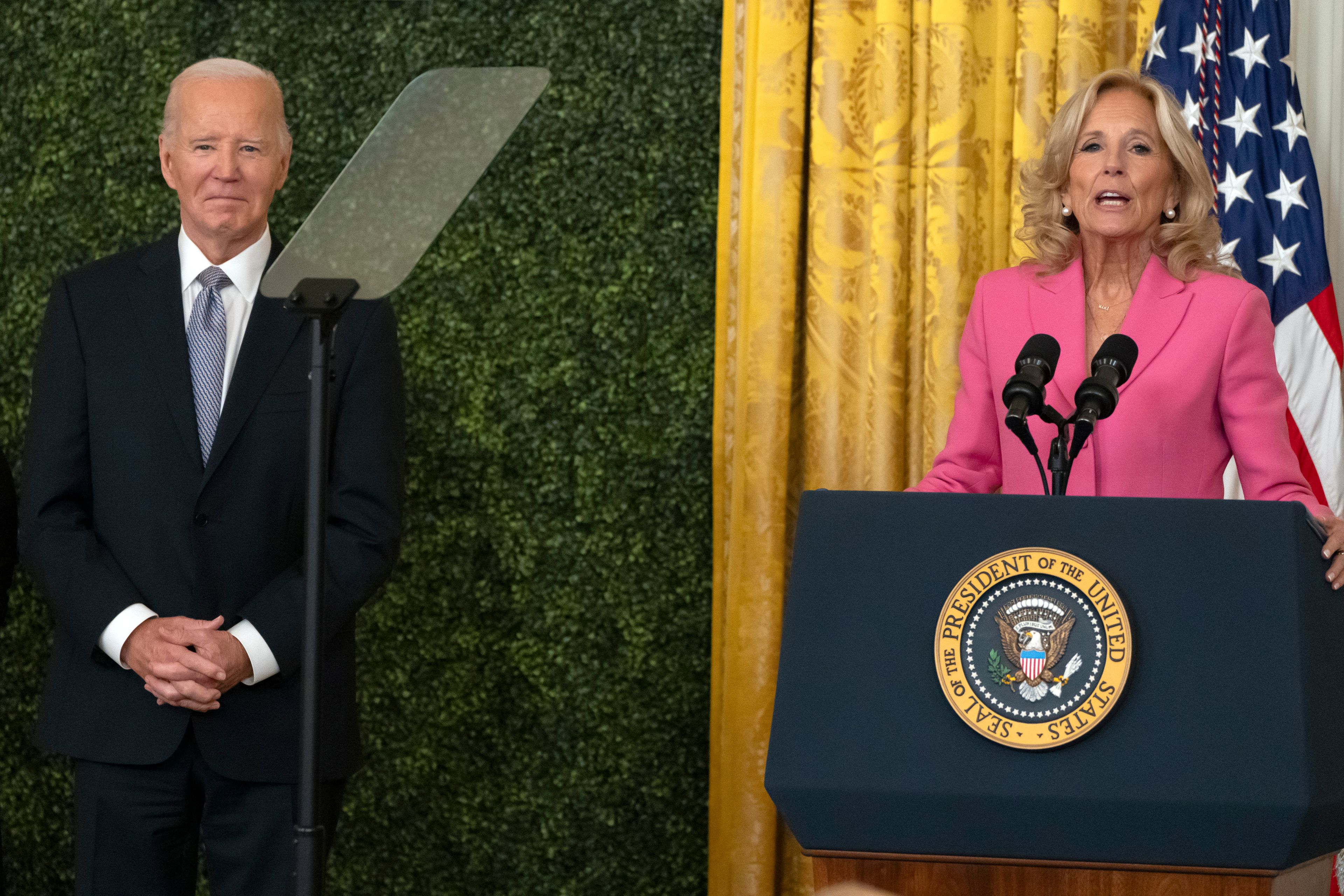 First lady Jill Biden speaks as President Joe Biden listen during a National Arts and Humanities Reception in the East Room at the White House in Washington, Monday, Oct. 21, 2024. (AP Photo/Mark Schiefelbein)