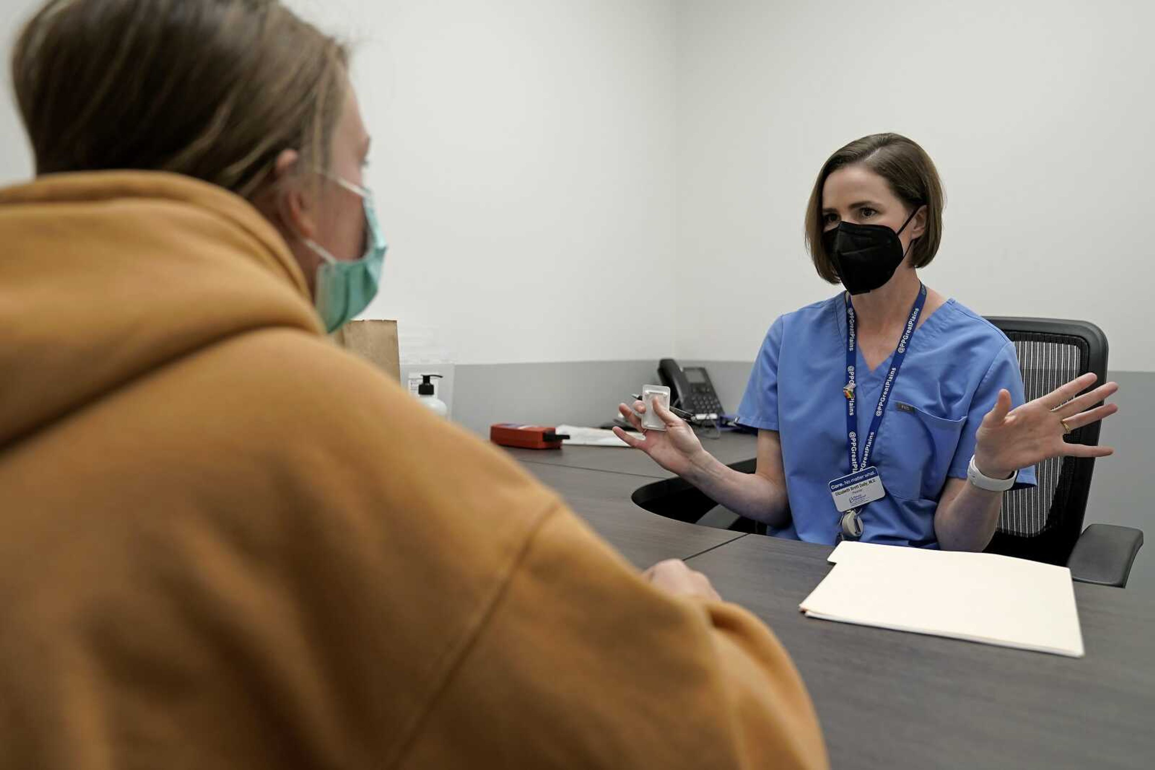 Dr. Daily talks with Ruark about the medical abortion process at a Planned Parenthood clinic Wednesday, Oct. 12, in Kansas City, Kansas.