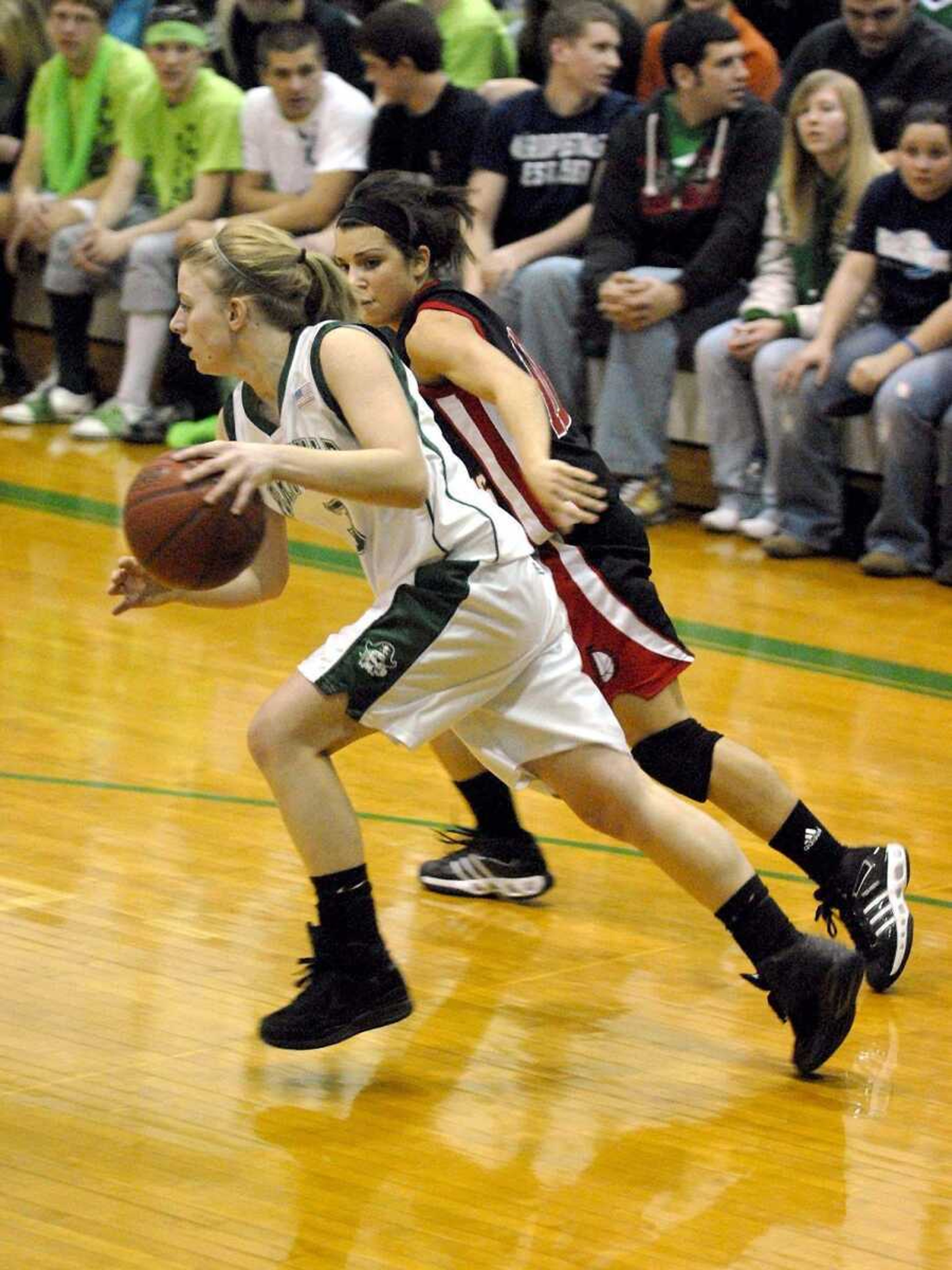 ELIZABETH DODD ~ edodd@semissourian.com<br>Perryville's Alicia Kueker dribbles past Jackson's Landon Wachter during their game earlier this season.