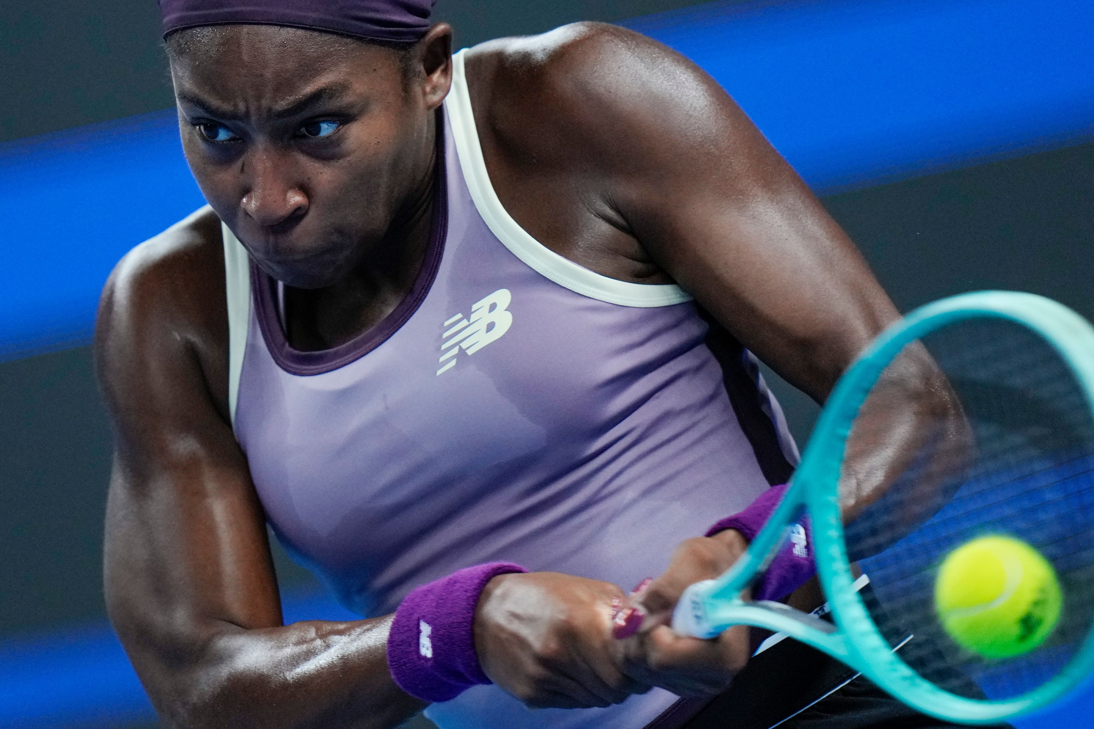 Coco Gauff of the United States returns a backhand shot to Katie Boulter of Great Britain during their women's singles match of the China Open tennis tournament, at the National Tennis Center in Beijing, Sunday, Sept. 29, 2024. (AP Photo/Andy Wong)