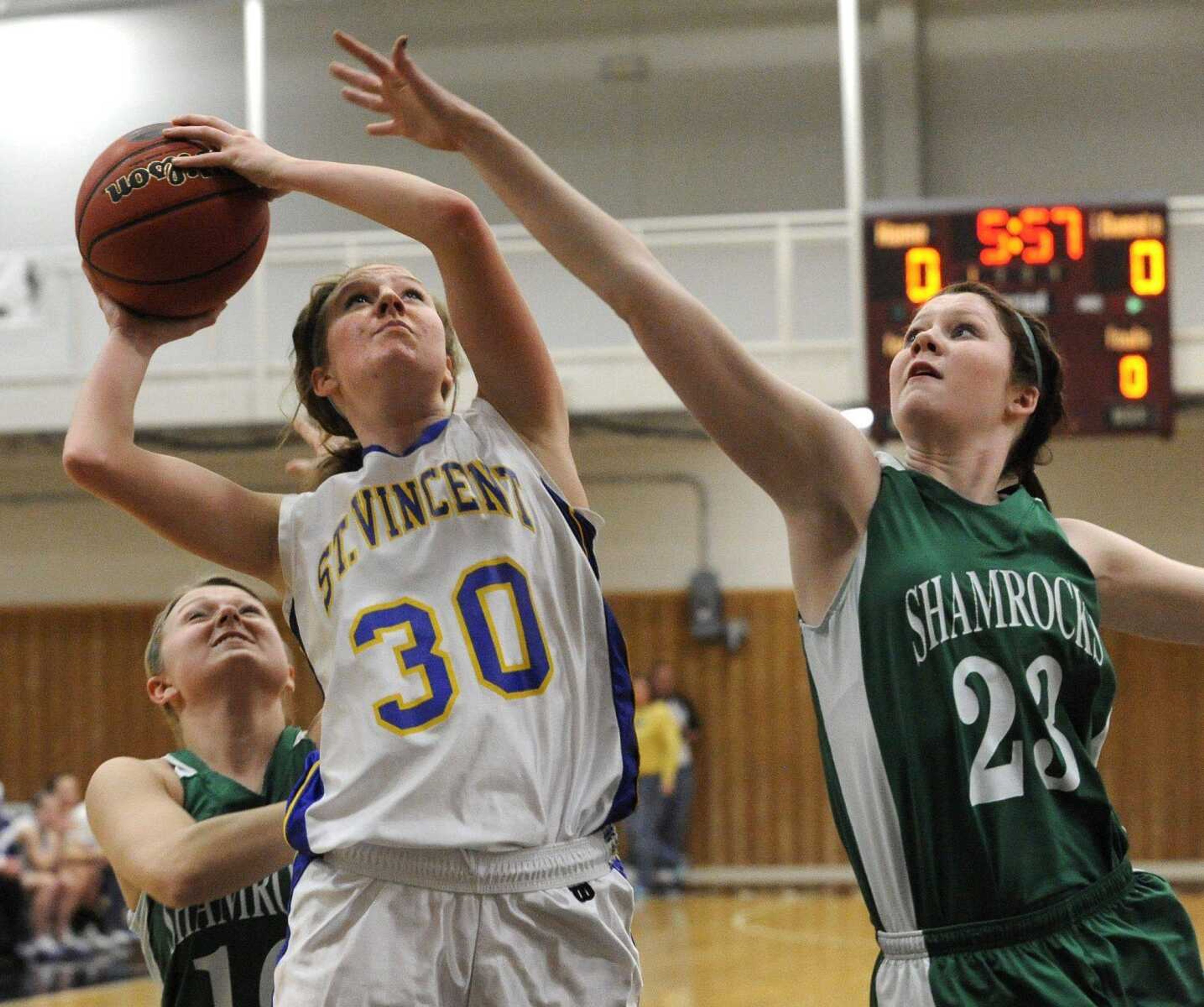 St. Vincent's Kali Wingerter shoots against New Haven's Elise McDonald during the first quarter of the Class 2 District 4 title game Friday, March 4, 2011 in Perryville, Mo. (Fred Lynch)