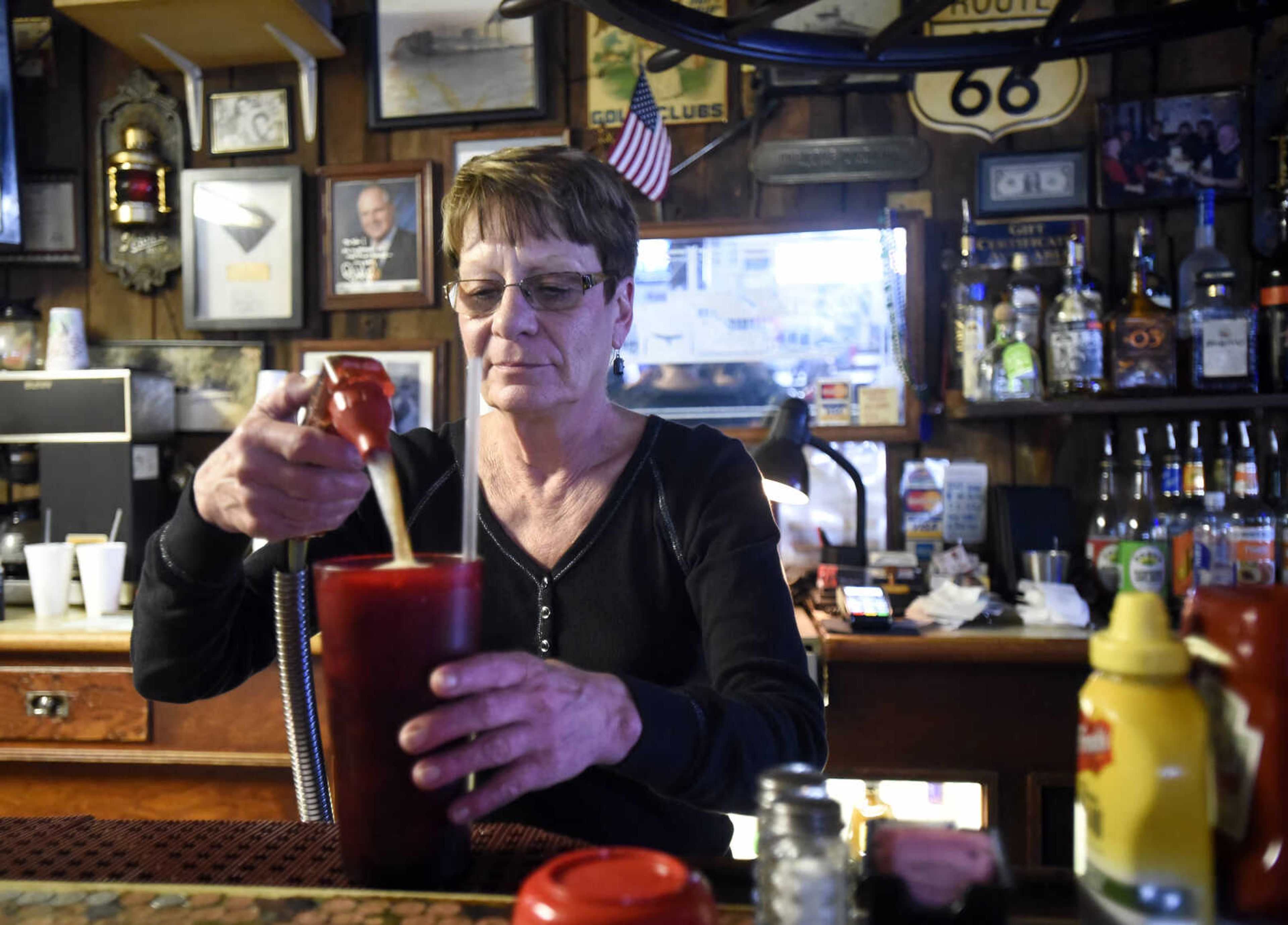 Carletta Bohnert fills a drink order at the Pilot House in Cape Girardeau.