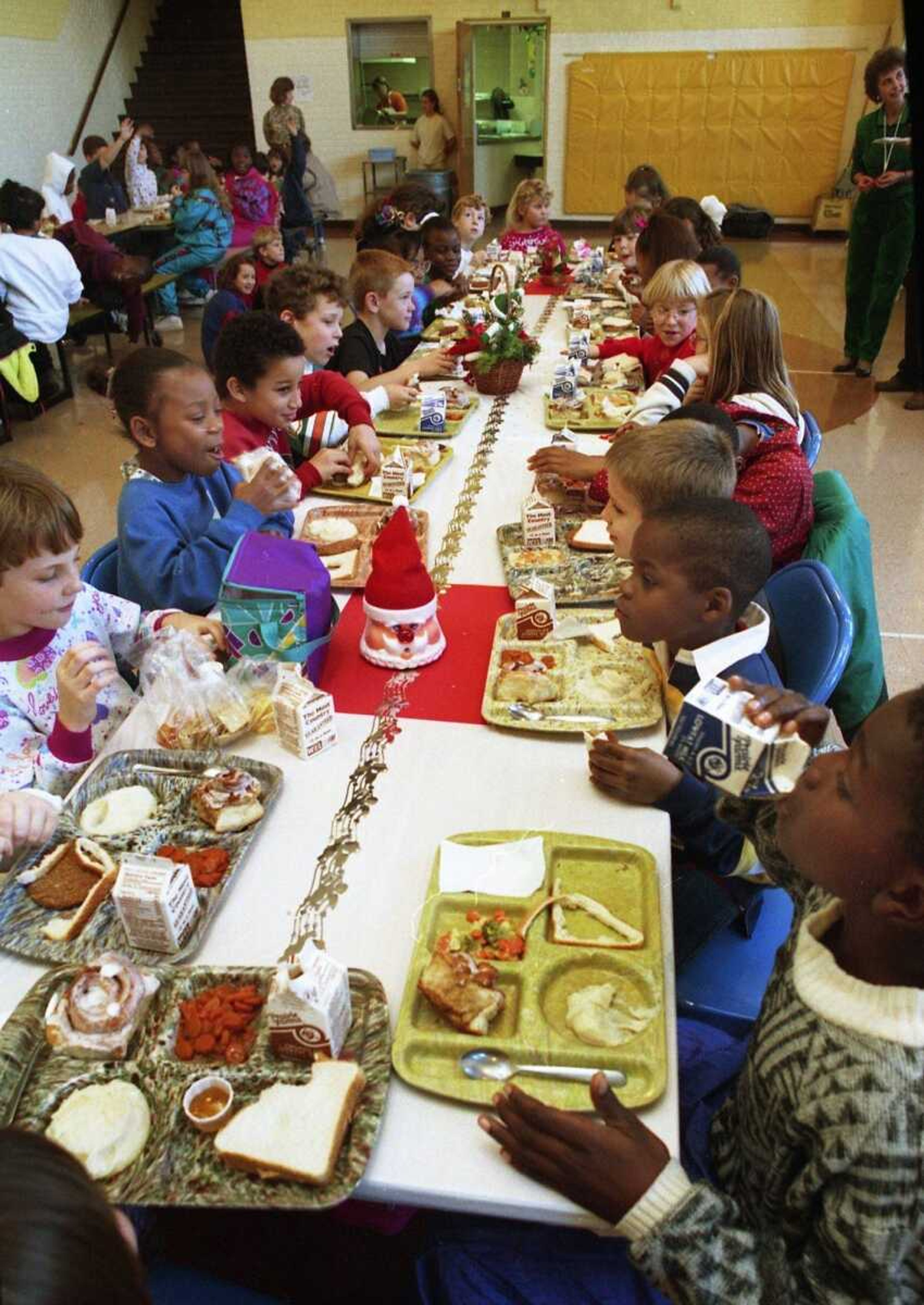 Dec. 13, 1994
Chris Johnston finished his milk while dining with other recipients of the Golden Tray Award at Washington School.