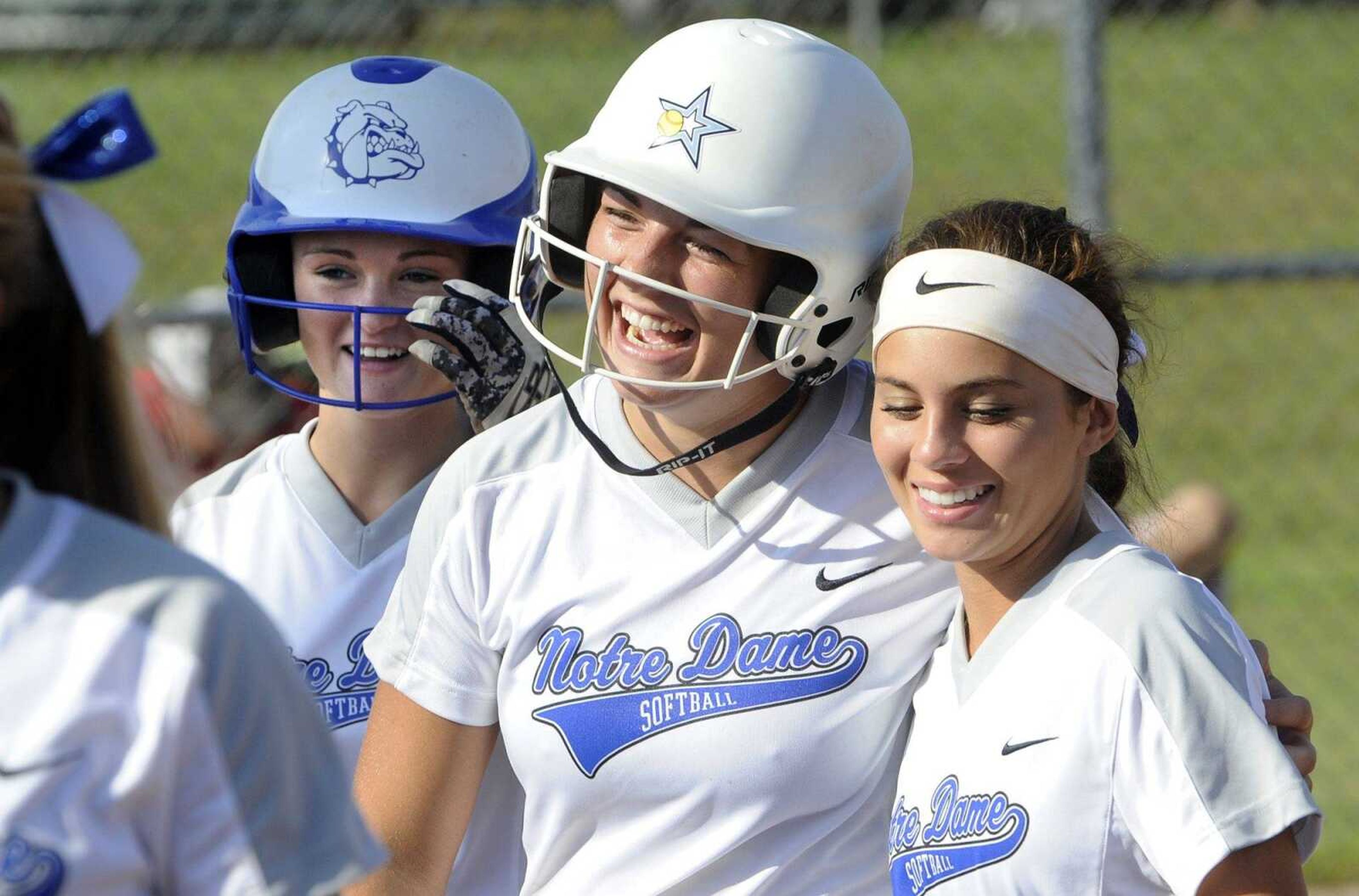 Notre Dame's Abby Rollet, center, celebrates after hitting a three-run home run against Chaffee during the third inning Wednesday at Notre Dame Regional High School. The Bulldogs won 8-4.