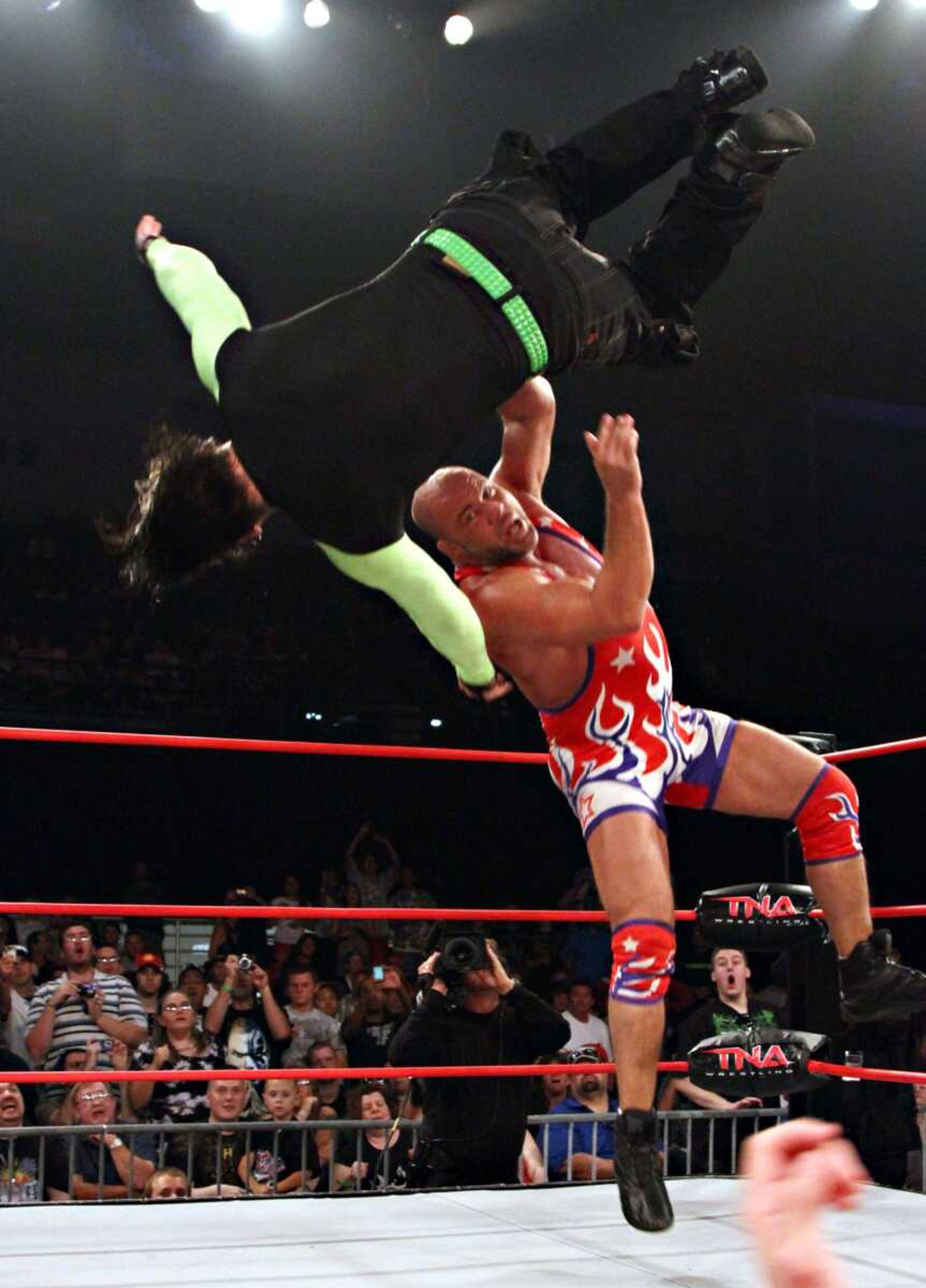 Kurt Angle tosses Jeff Hardy in a TNA wrestling match. (TNA Impact Wrestling)