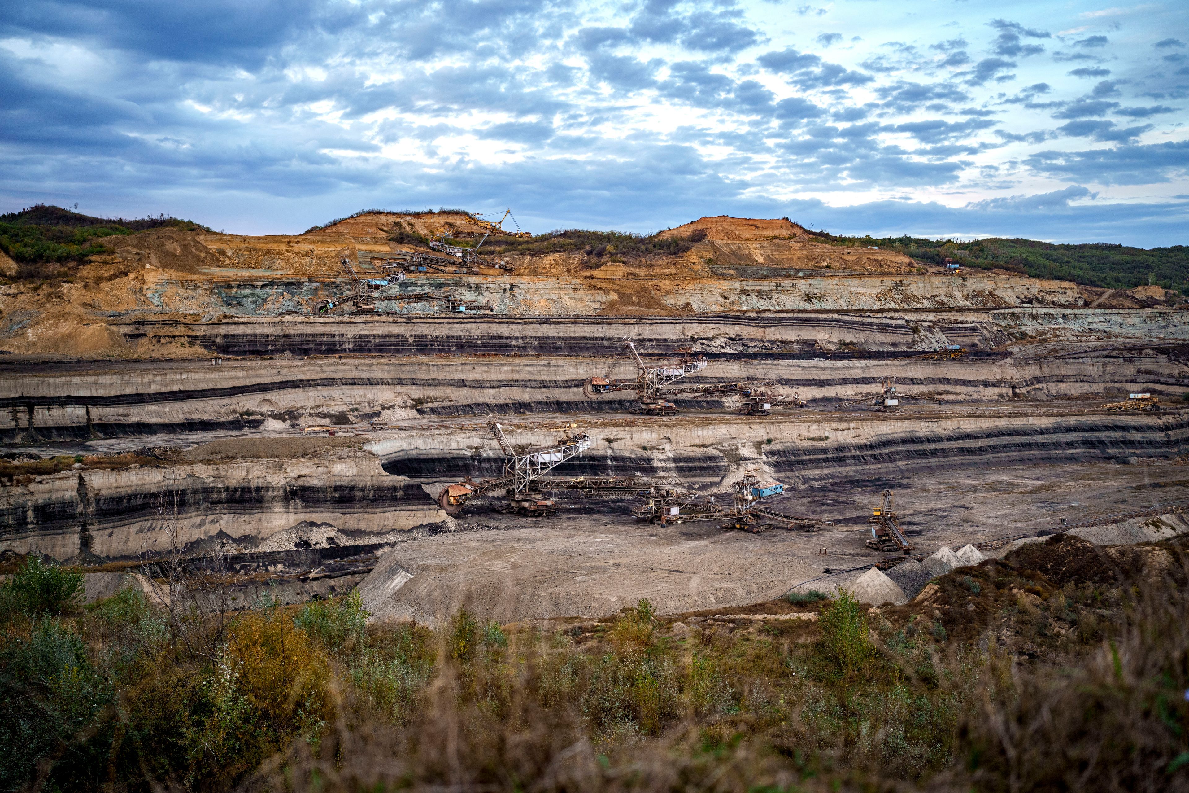 Coal extraction equipment operates at the open air quarry outside Matasari, southern Romania, Friday, Oct. 11, 2024. (AP Photo/Vadim Ghirda)