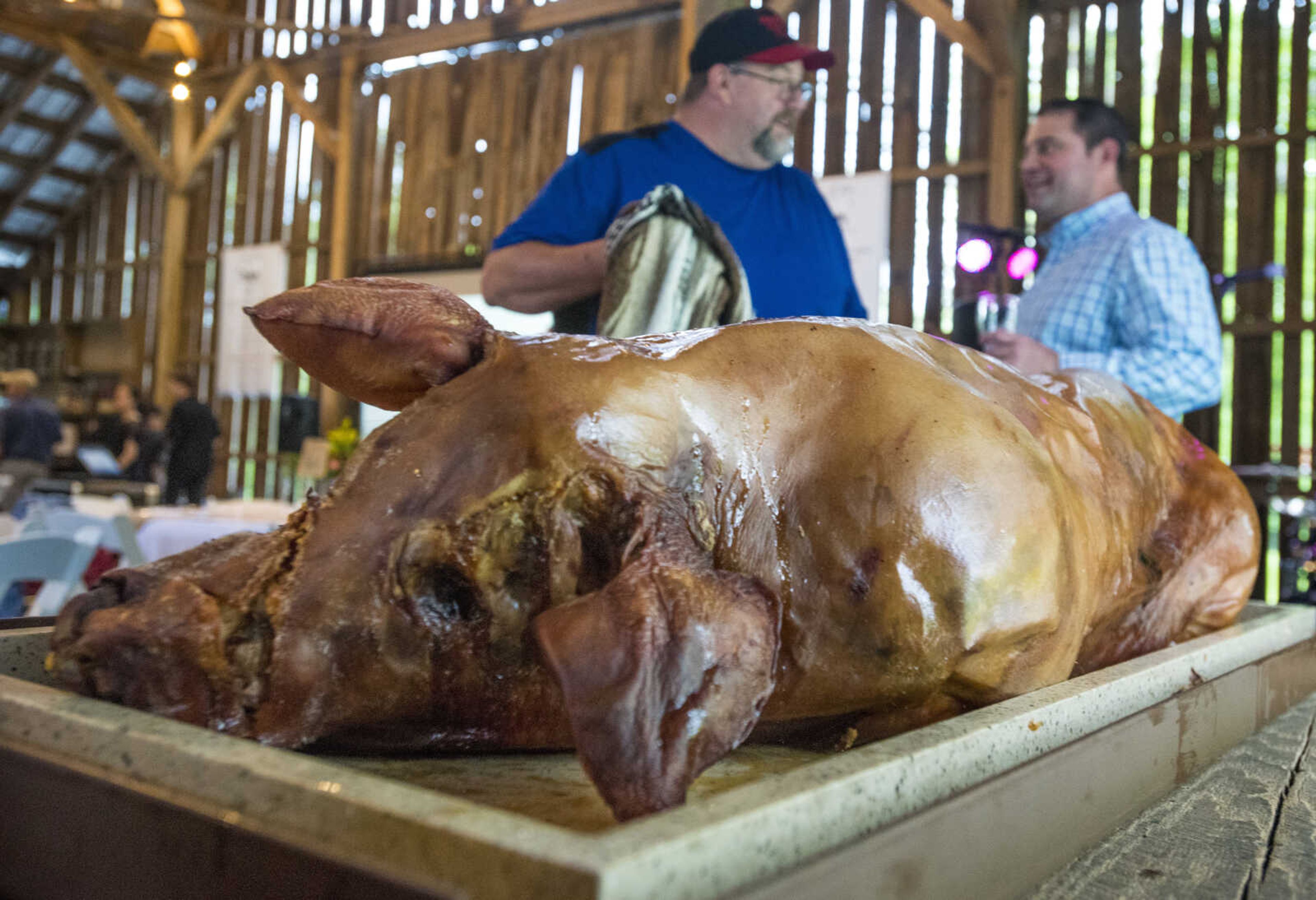 A freshly roasted pig is served at Rusted Route Farms on April 29, 2017 during a Swine & Dine pig roast benefiting The Tailor Institute.