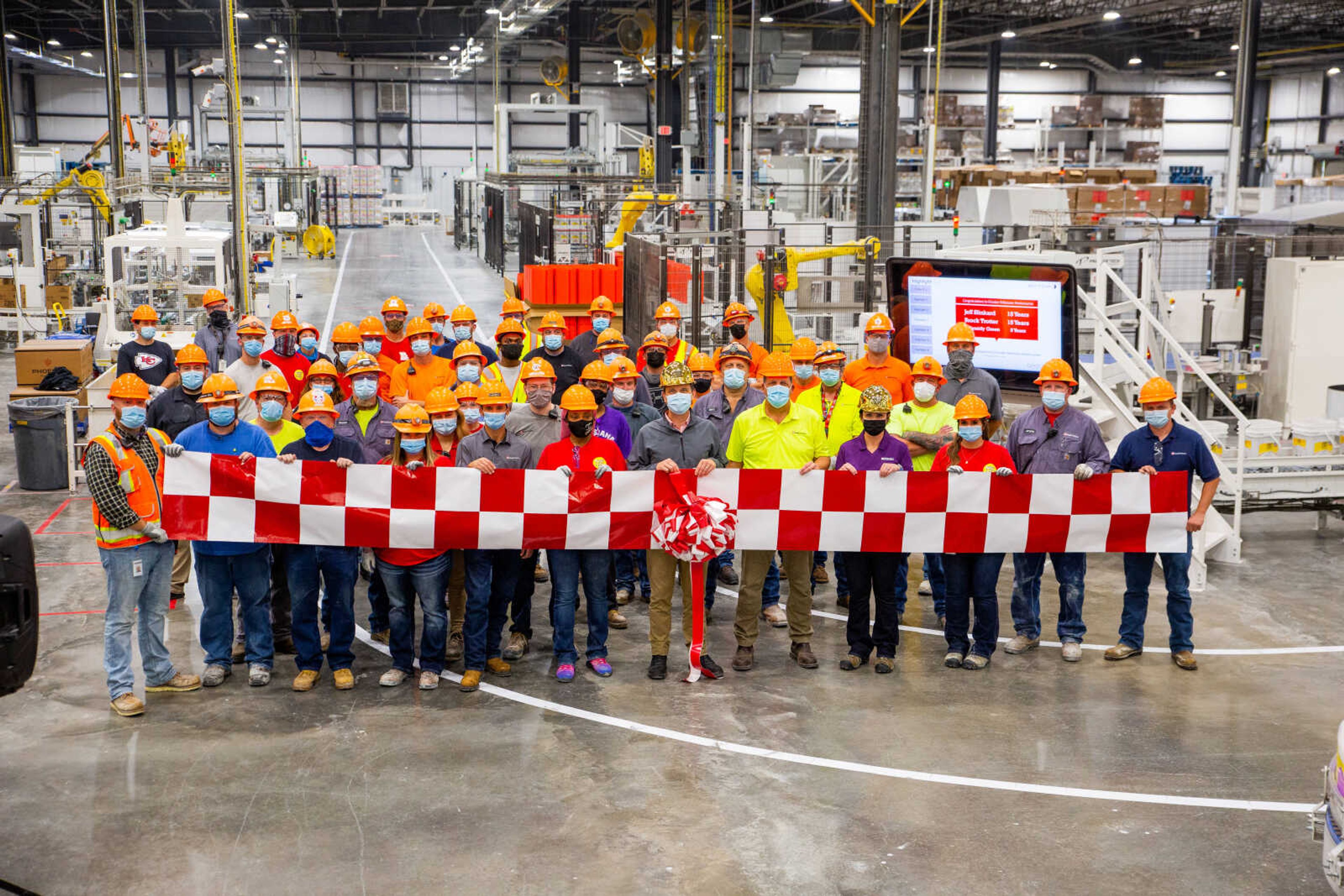 Factory associates gather to celebrate the completion of a $250 million expansion at Purina's manufacturing facility in Bloomfield, Missouri. The expansion results in 75 new positions at the factory, which now employs more than 450 people.