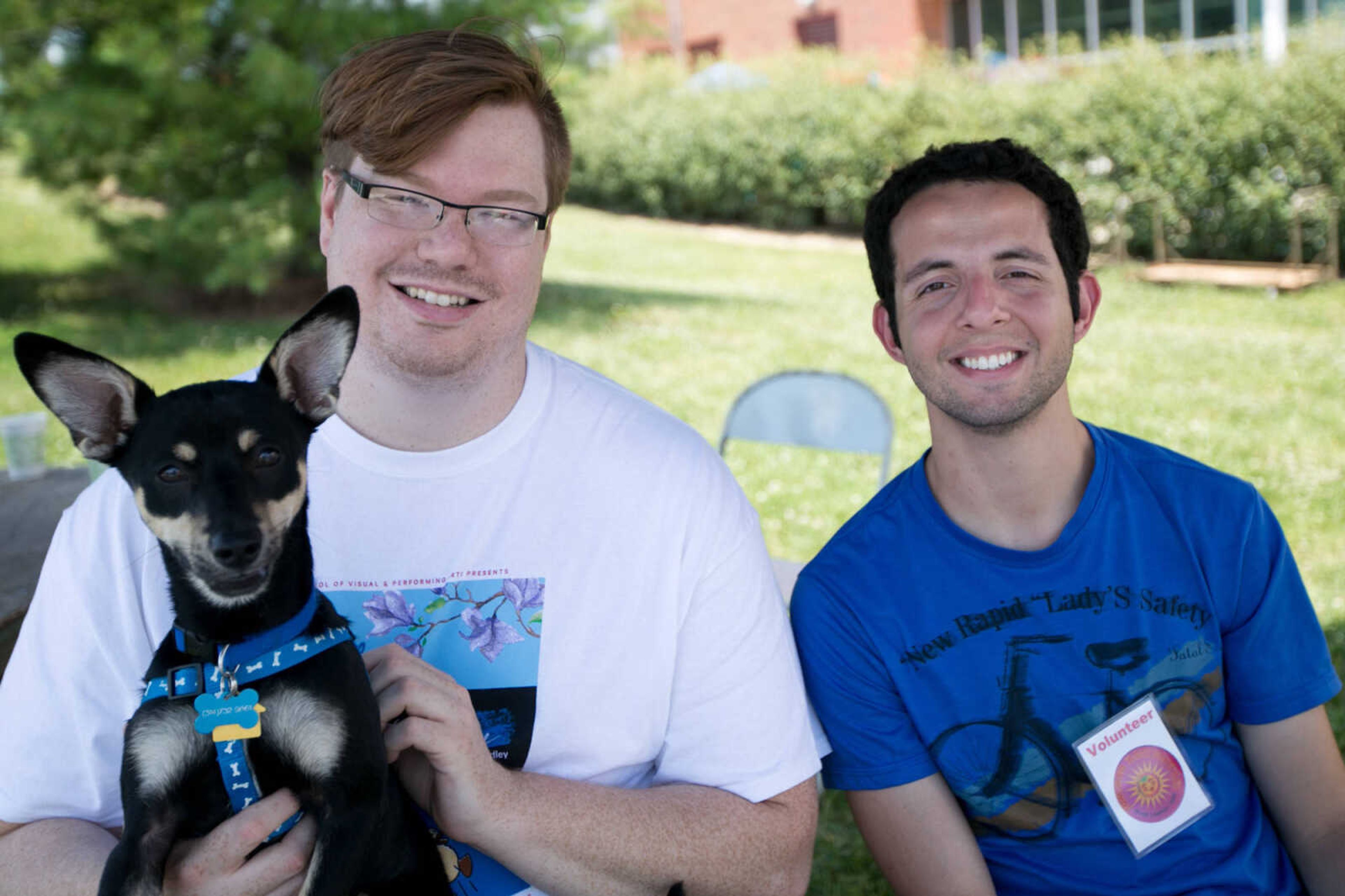 GLENN LANDBERG ~ glandberg@semissourian.com

Ryan Jones, left, Nando Lopes and Bandit pose for a photo Saturday, June 18, 2016 at the River Campus Summer Arts Festival.