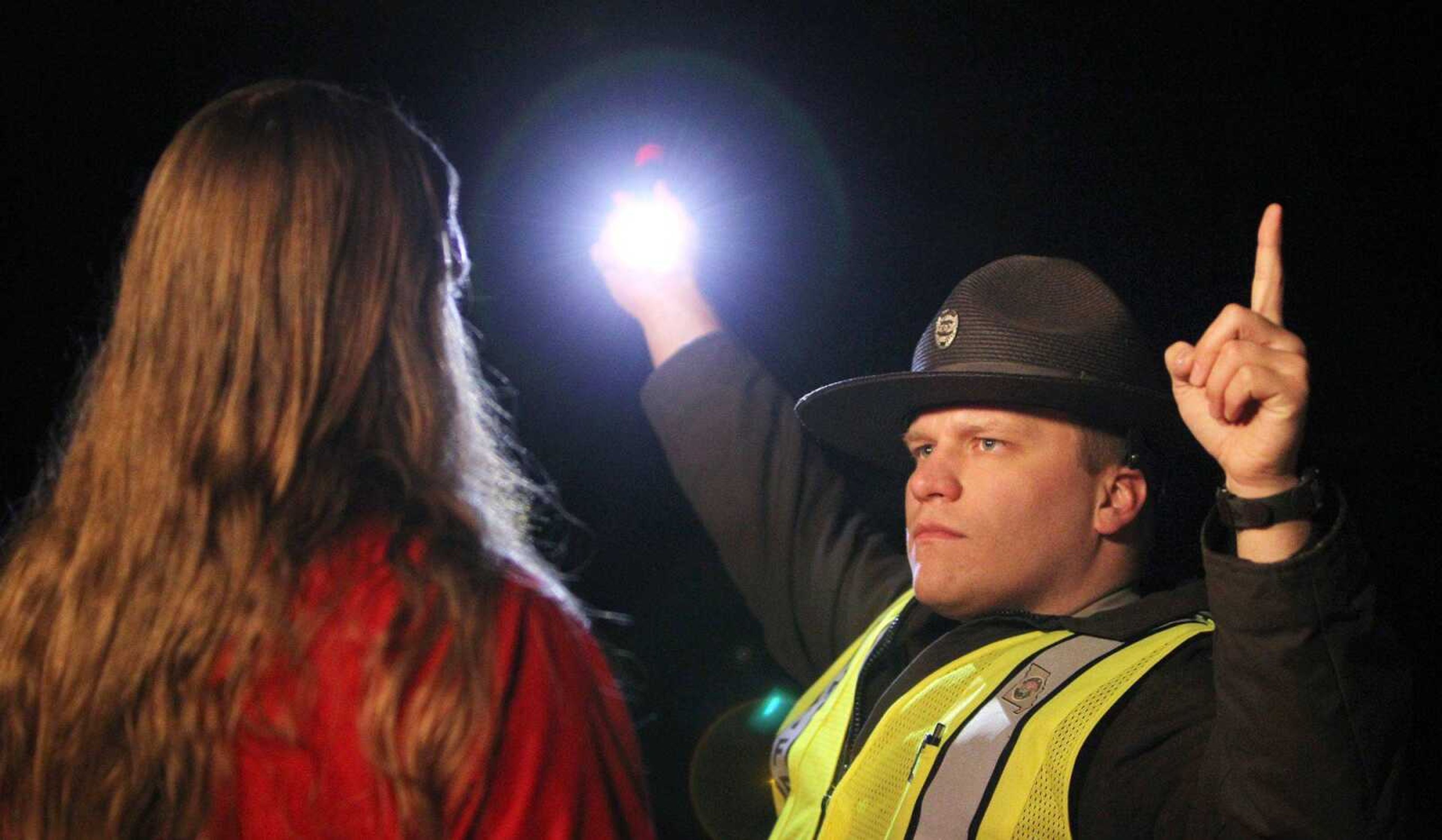 Deputy Sheriff Aaron Peifer of the Jefferson County Sheriff&#8217;s Office conducts a standardized field sobriety test at a sobriety checkpoint April 3 in Arnold, Mo. The driver was permitted to go on his way after the test. (Chris Lee ~ St. Louis Post-Dispatch)