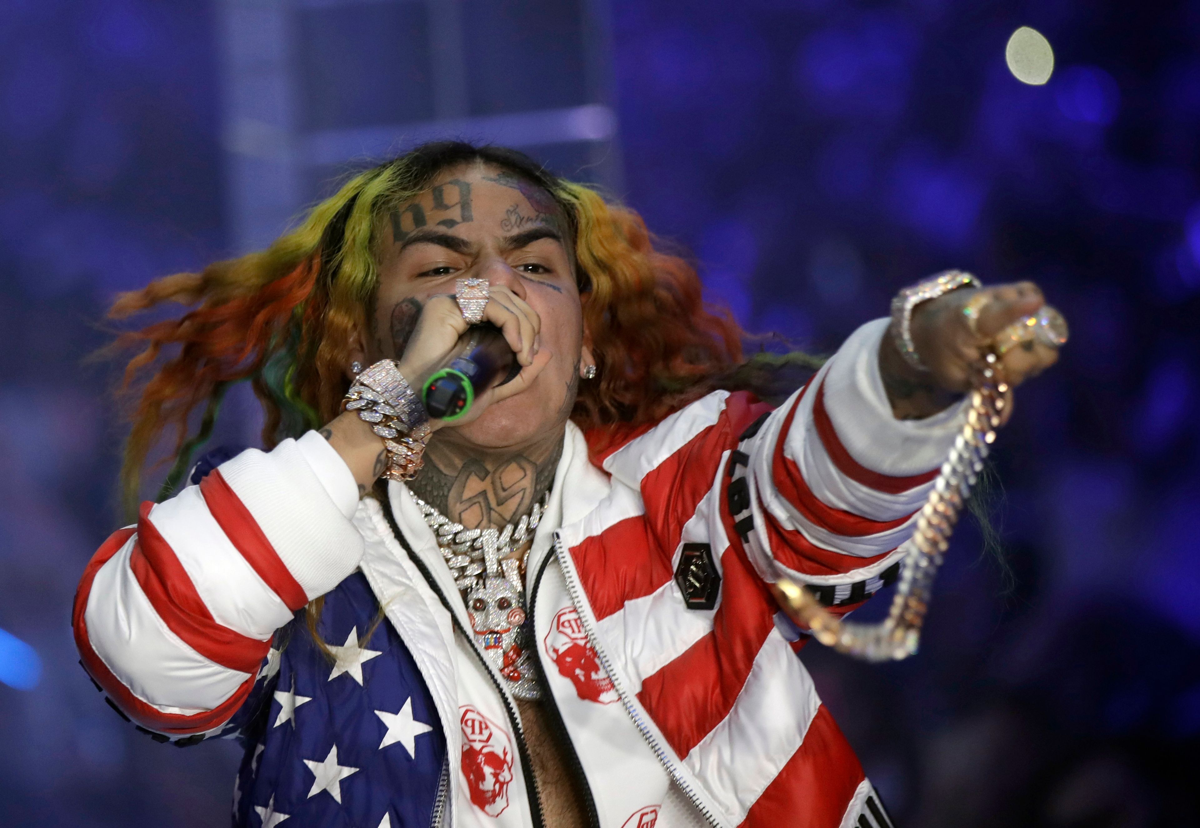 FILE - Rapper Daniel Hernandez, known as Tekashi 6ix9ine, performs during the Philipp Plein Women's 2019 Spring-Summer Collection at Fashion Week in Milan, Italy, Sept. 21, 2018. (AP Photo/Luca Bruno, File)