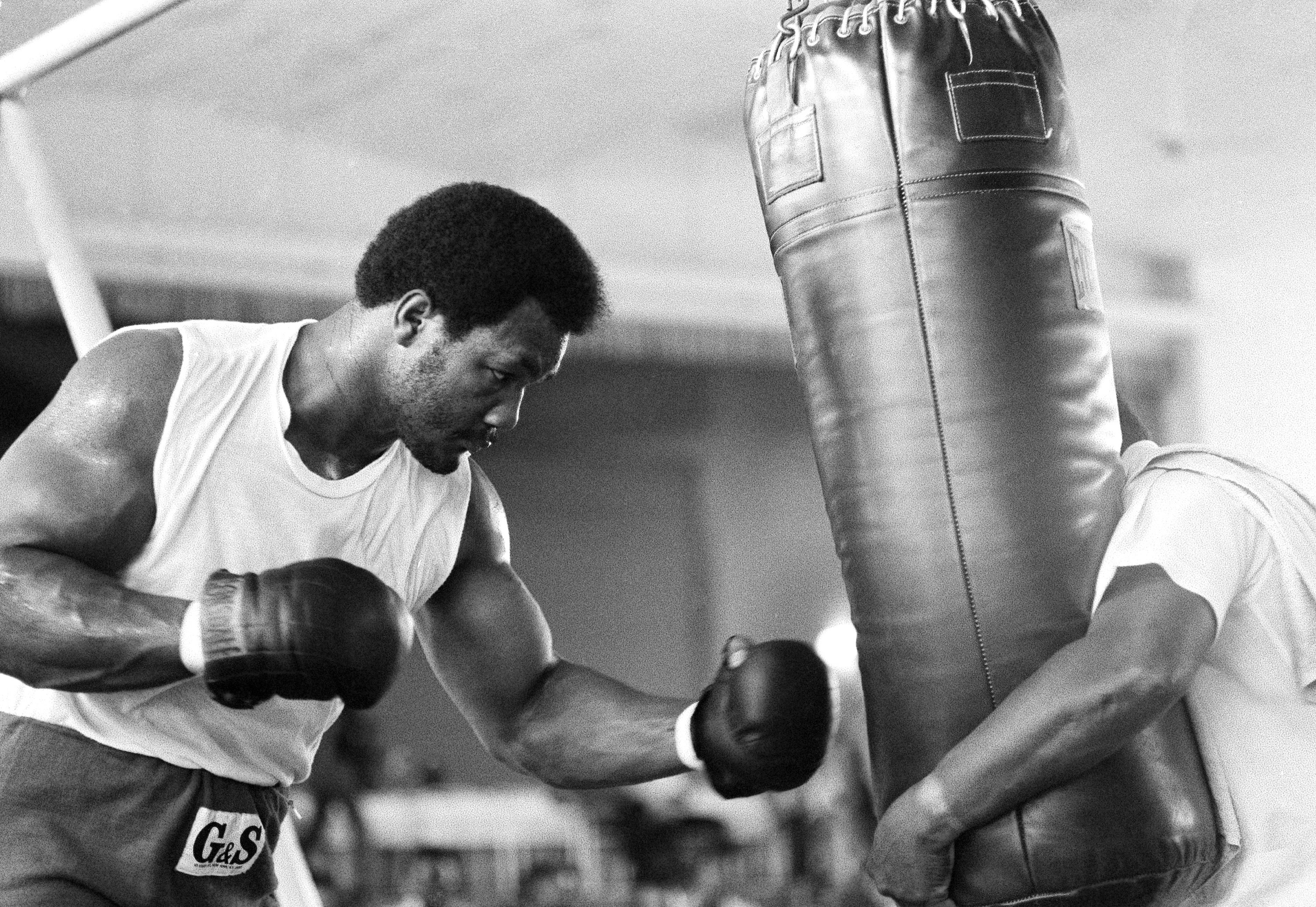 FILE - George Foreman works out after his eye injury, in preparation for his fight against Muhammad Ali in Kinshasa, Zaire on Oct. 2, 1974. (AP Photo/Horst Faas, File)