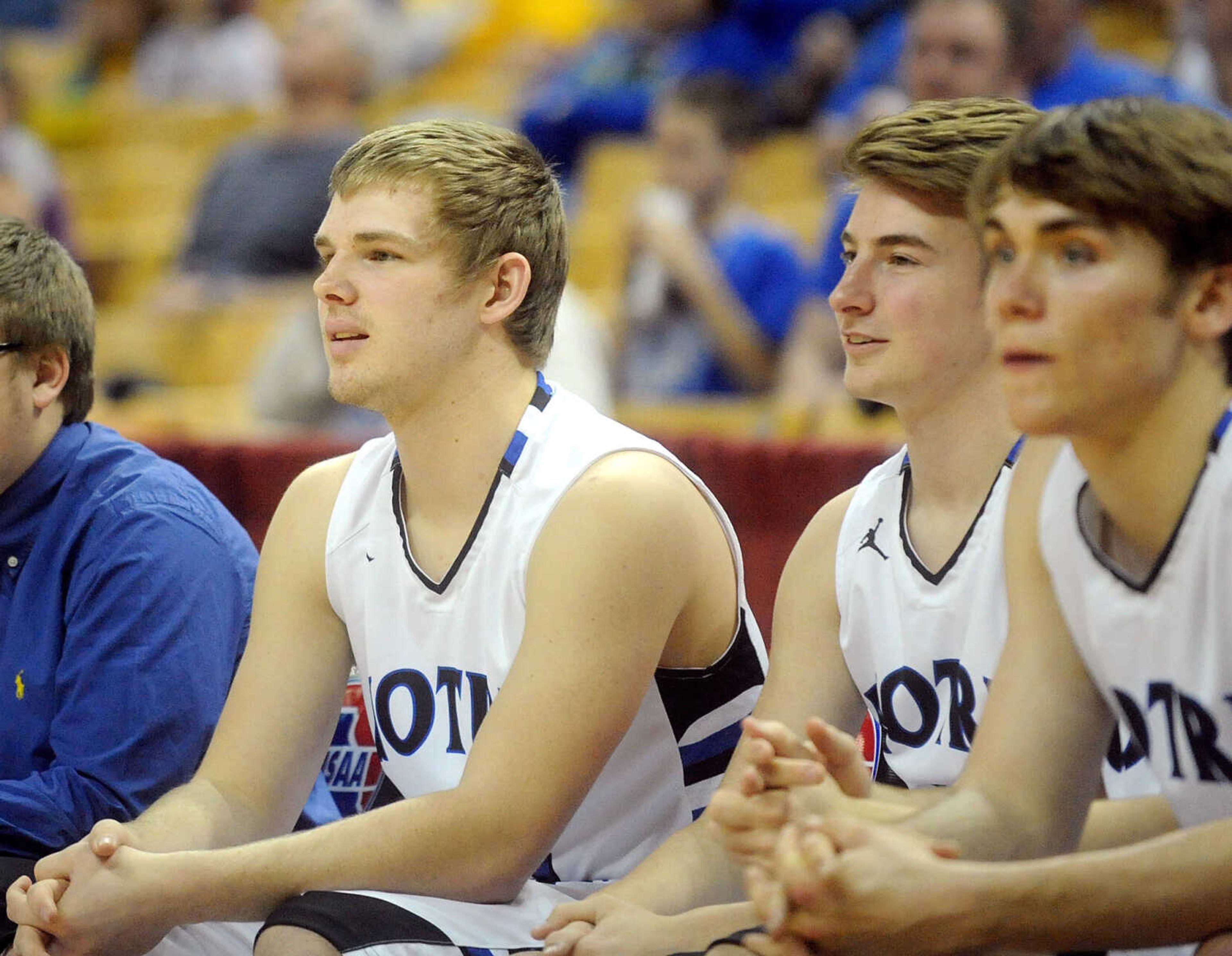 Notre Dame Derek Hulshof, left, Grant Ressel, center, and Dean Crippen watch the action from the sideline in the fourth quarter of the Bulldogs Class 4 third-place game against the Bolivar Liberators, Friday, March 20, 2015, in Columbia, Missouri. Notre Dame won 65-44. (Laura Simon)