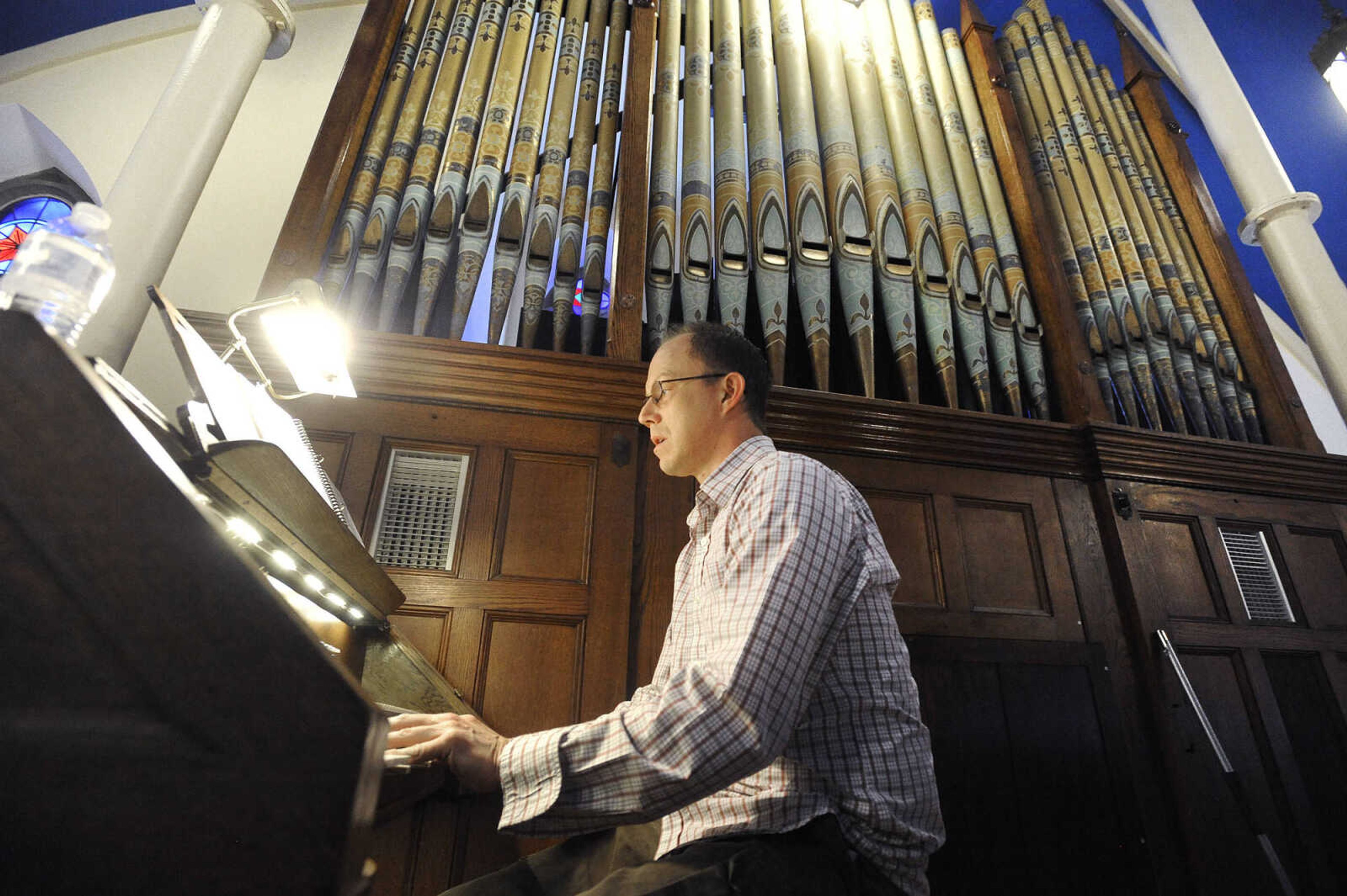 LAURA SIMON ~ lsimon@semissourian.com

Daniel Seiler, music director at St. John's Catholic Church in Leopold, Missouri, plays the organ during a wedding on Saturday, May 21, 2016.