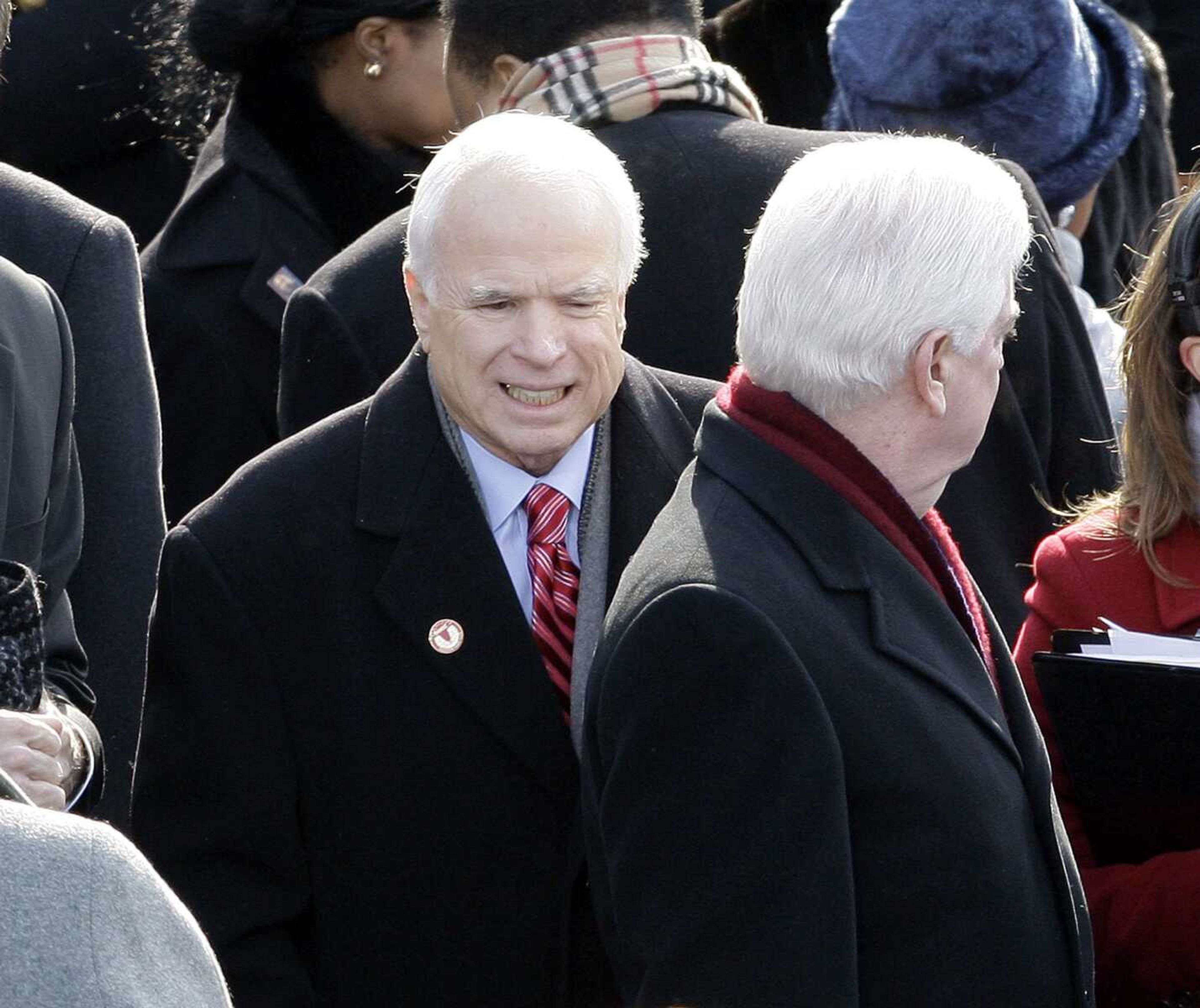 U.S. Sen. John McCain, R-Ariz., finds his seat as he arrives for the inauguration ceremony at the U.S. Capitol in Washington, Tuesday, Jan. 20, 2009. (AP Photo/Jeff Christensen)