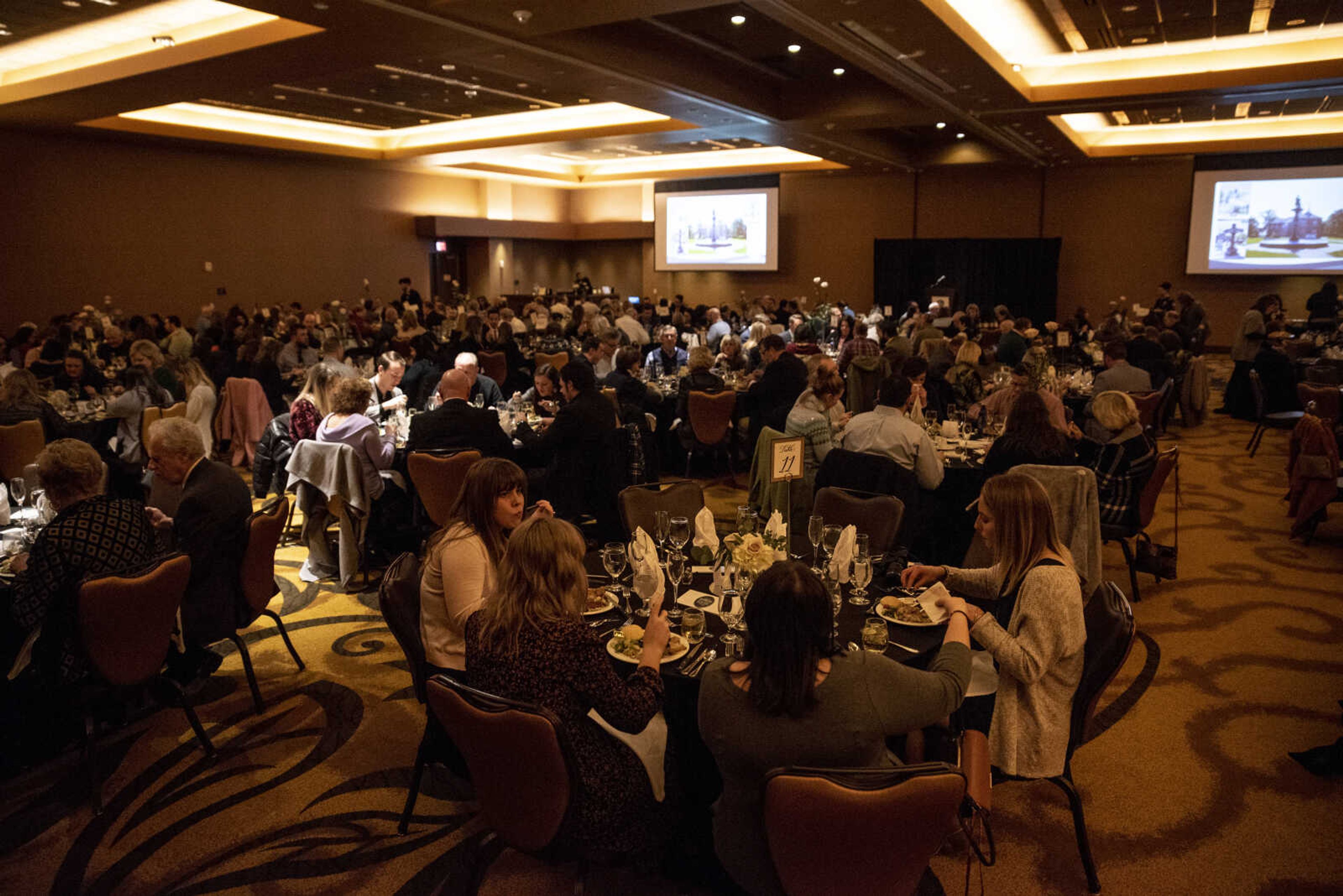 Community members sit at tables and enjoy the Old Town Cape 20th anniversary dinner celebration at the Isle Casino Thursday, Feb. 28, 2019, in Cape Girardeau.