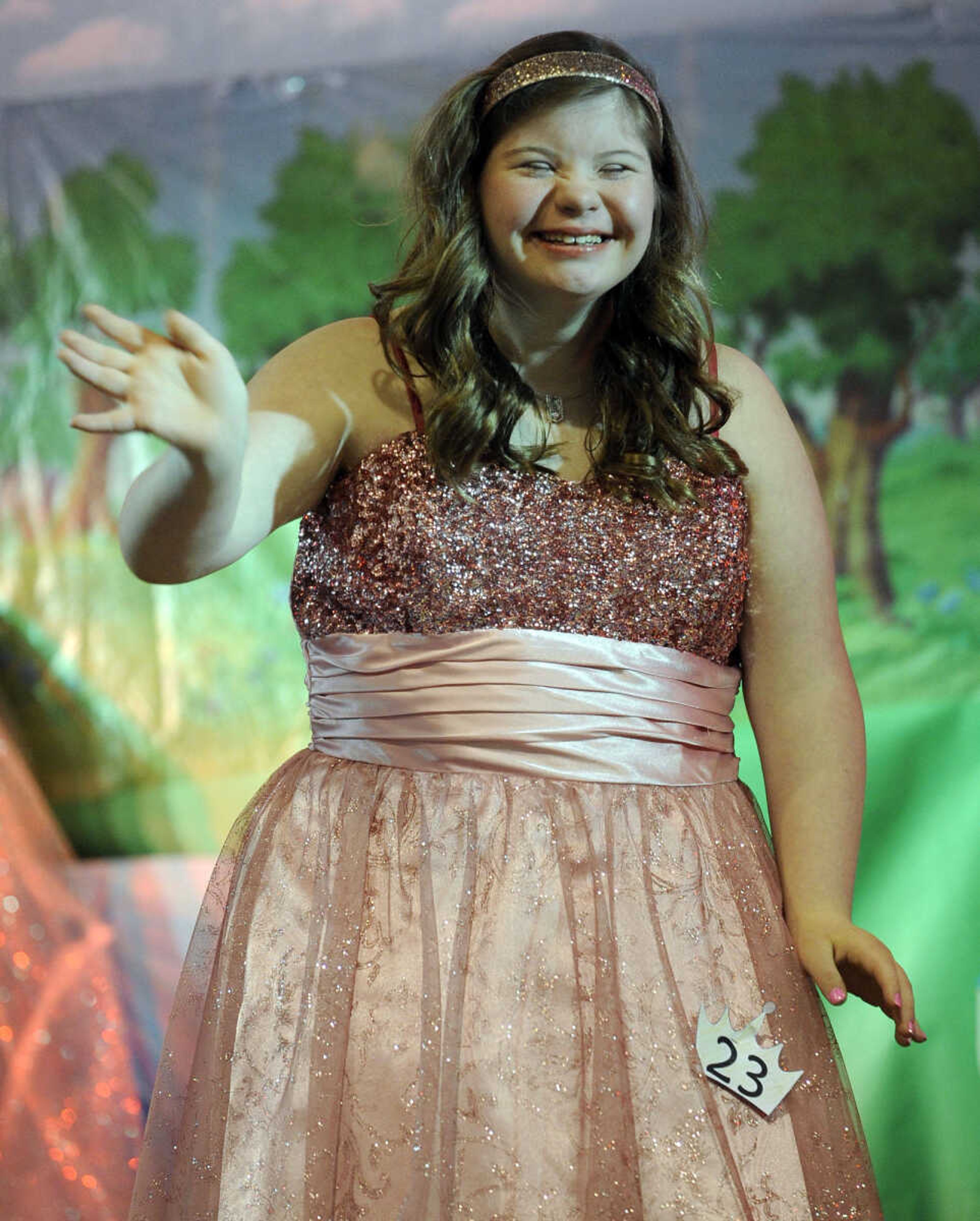 Cori Brennecke waves to the crowd in the 15-19 age division of the S. E. Missouri Angels Pageant on Saturday, April 26, 2014 at Scott City High School.