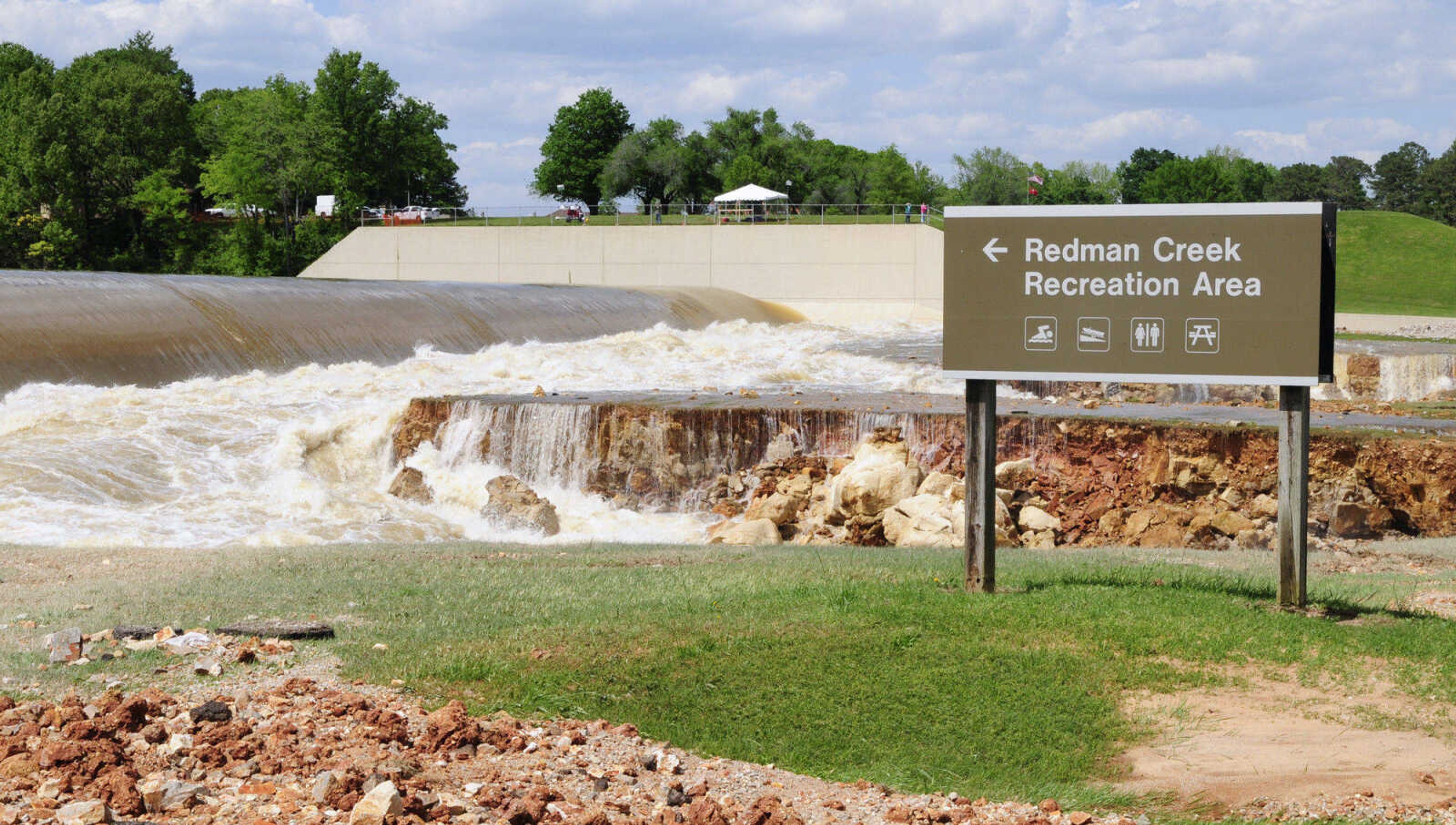 Wappapello Lake in Wayne County, Mo., overflows its emergency spillway near the Redman Creek Recreation Area Tuesday, May 3, 2011. A nearly 400-foot-long section of Highway T, just out of the frame to the right, was destroyed. Heavy rains brought record flooding to the lake, which sits on the St. Francis River. (AP Photo/Daily American Republic, Paul Davis)