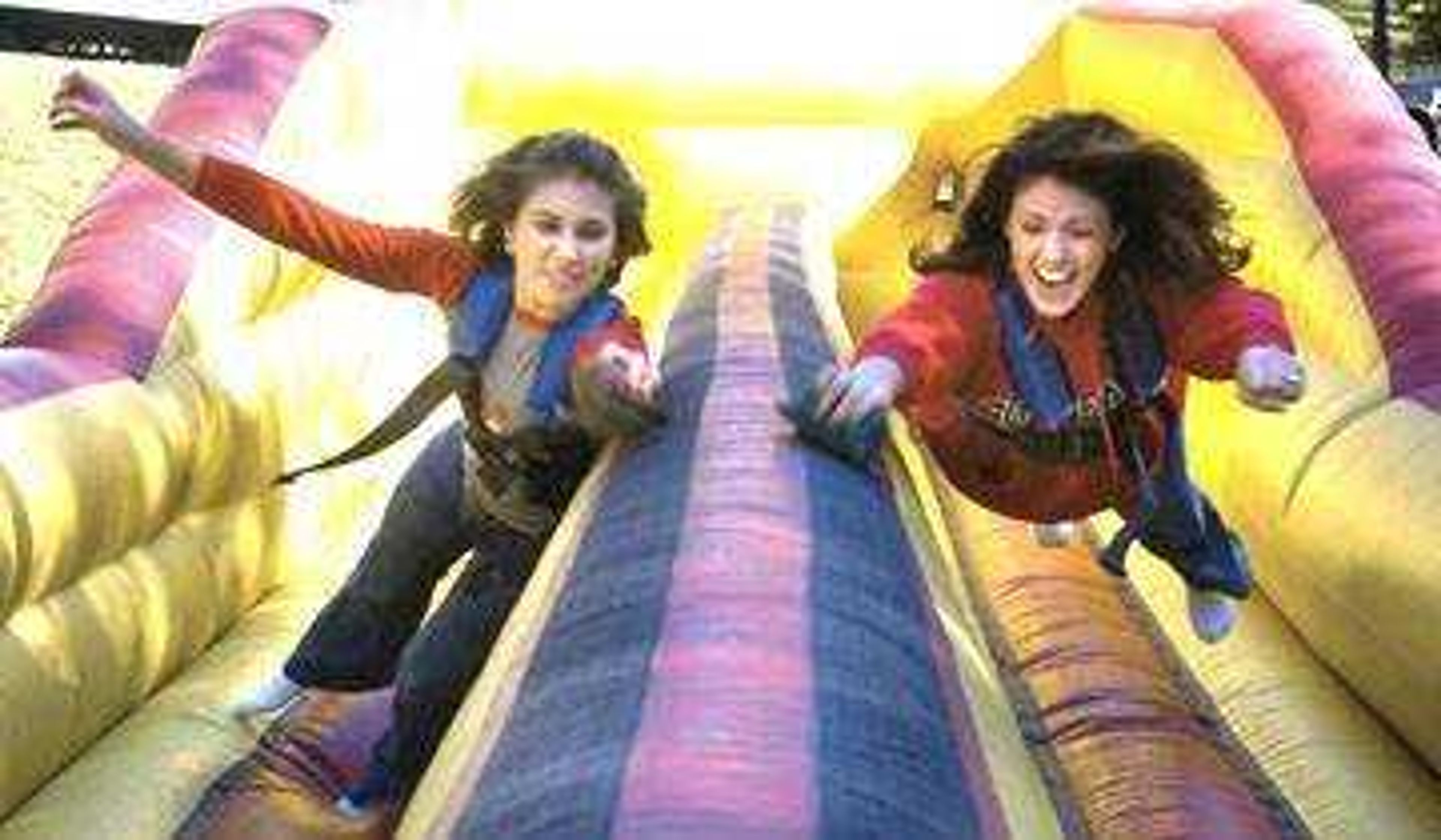 Pam Epplin, left, of Cape Girardeau challenged her former roommate, Rebekah Hunt of Troy, Ill. in the "bungee run" at the homecoming picnic on the terraces of Academic Hall. Both are 2005 graduates of Southeast.