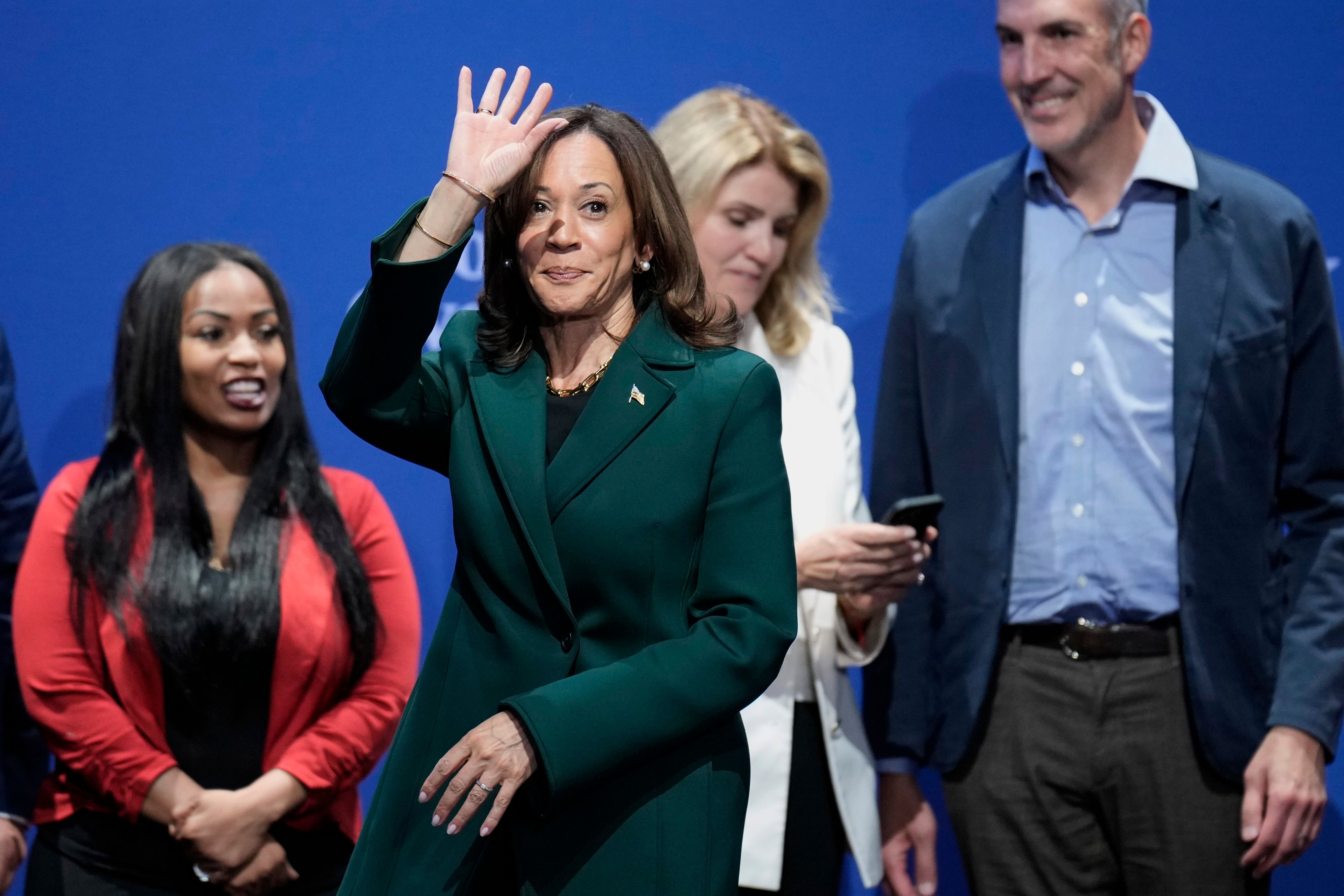 Democratic presidential nominee Vice President Kamala Harris waves at the conclusion of a town hall at the Royal Oak Theatre in Royal Oak, Mich., Monday, Oct. 21, 2024. (AP Photo/Jacquelyn Martin)