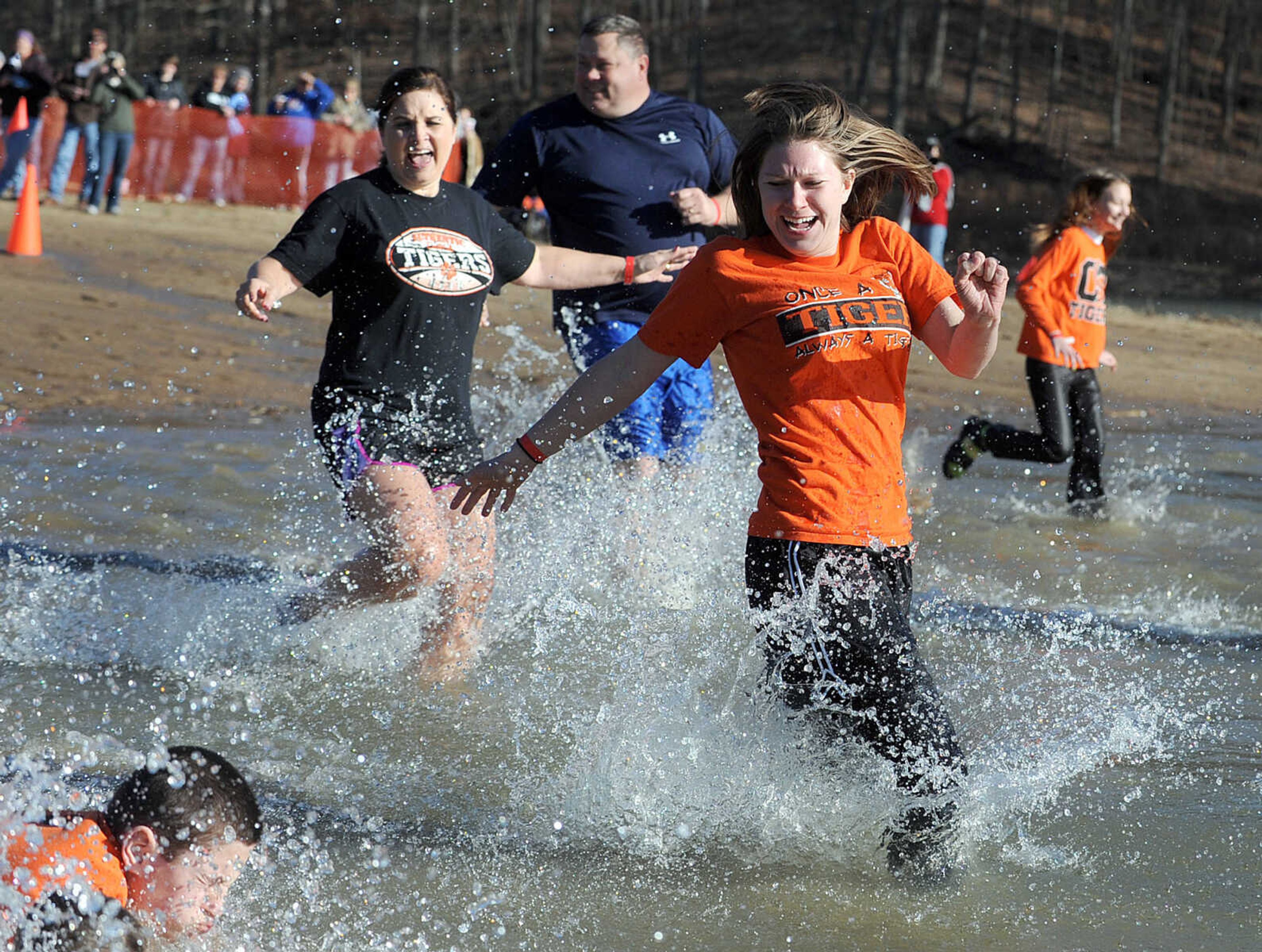 LAURA SIMON ~ lsimon@semissourian.com
People plunge into the cold waters of Lake Boutin Saturday afternoon, Feb. 2, 2013 during the Polar Plunge at Trail of Tears State Park. Thirty-six teams totaling 291 people took the annual plunge that benefits Special Olympics Missouri.