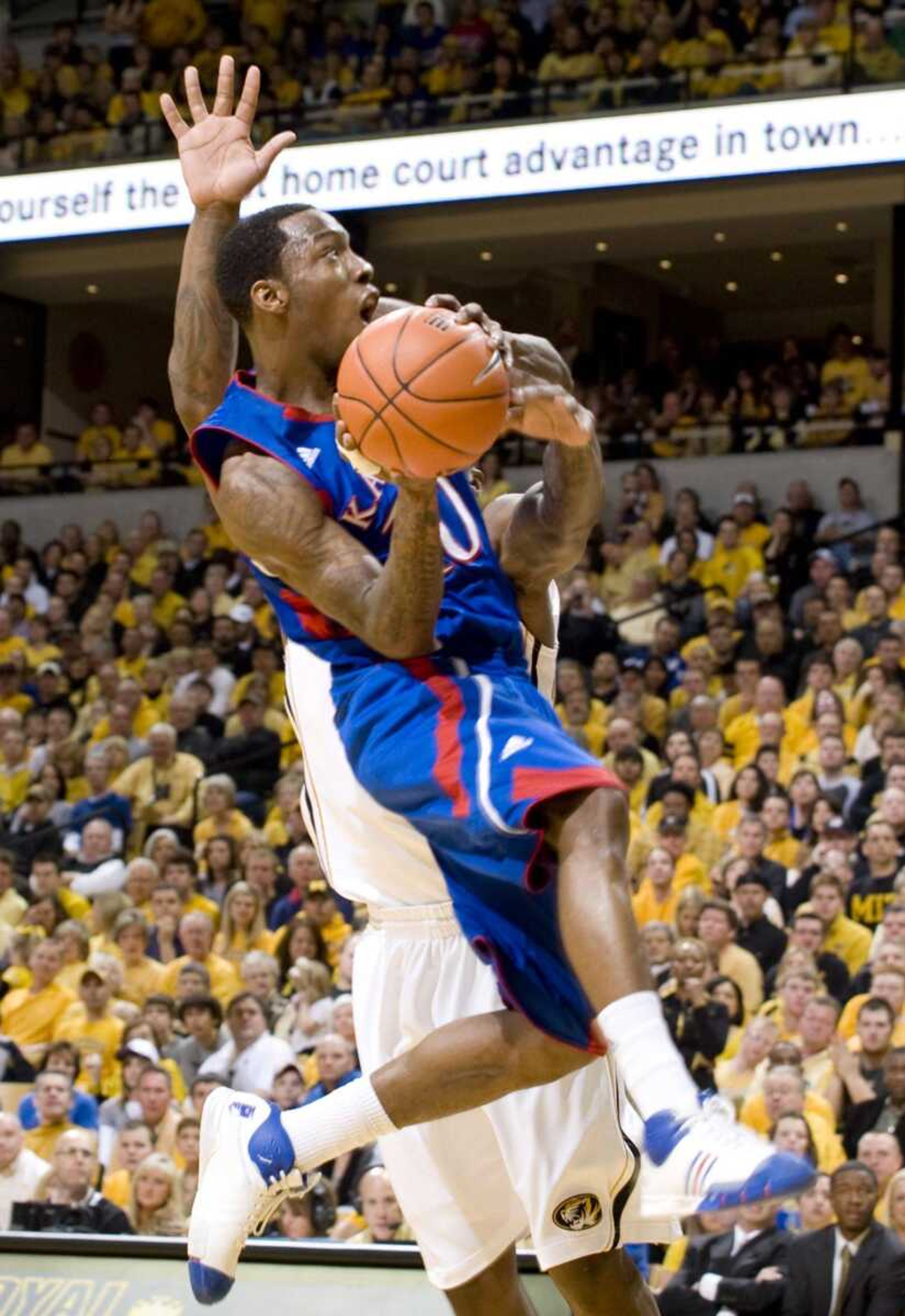 Kansas' Tyshawn Taylor shoots while defended by Missouri's Ricardo Ratliffe during the first half Saturday in Columbia, Mo. (L.G. PATTERSON ~ Associated Press)