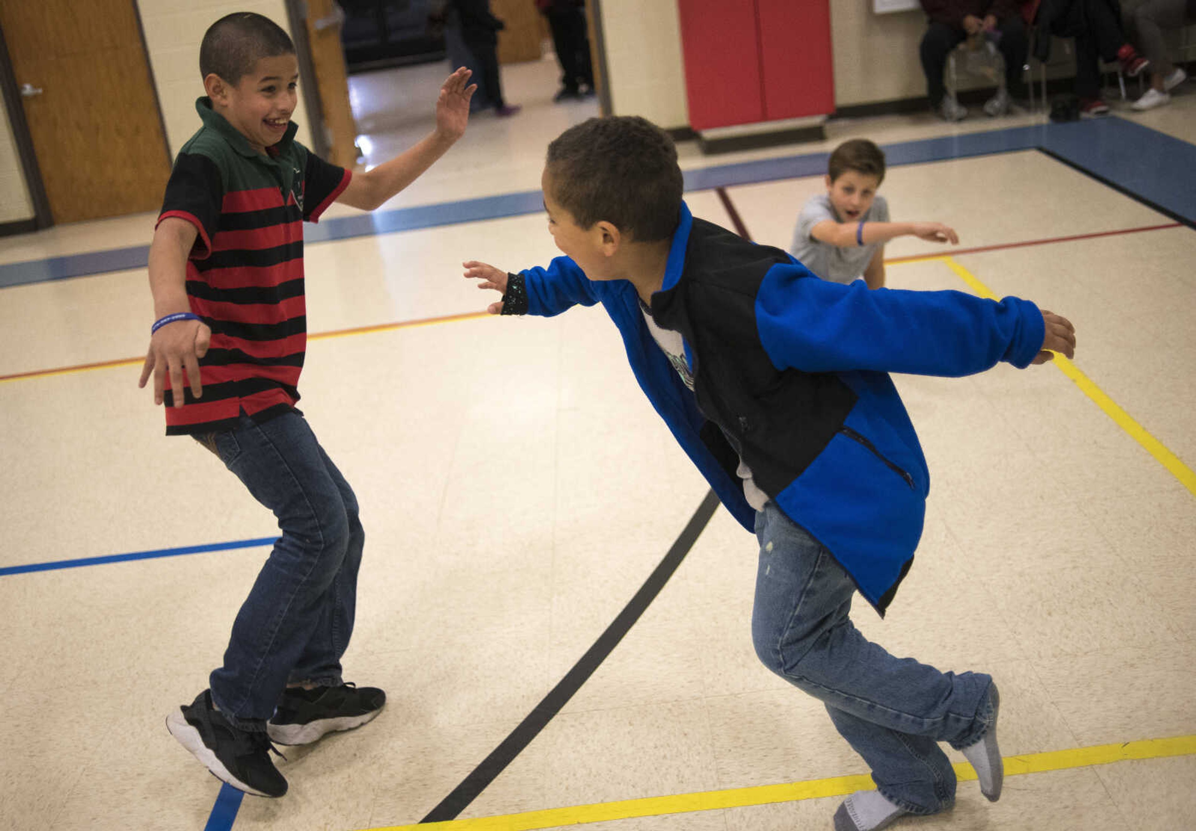 Alexander Santos, 11, left, and Jordan Criddle, 7, play tag during the Fall Family Festival Friday, Nov. 17, 2017 at the Shawnee Park Center in Cape Girardeau.