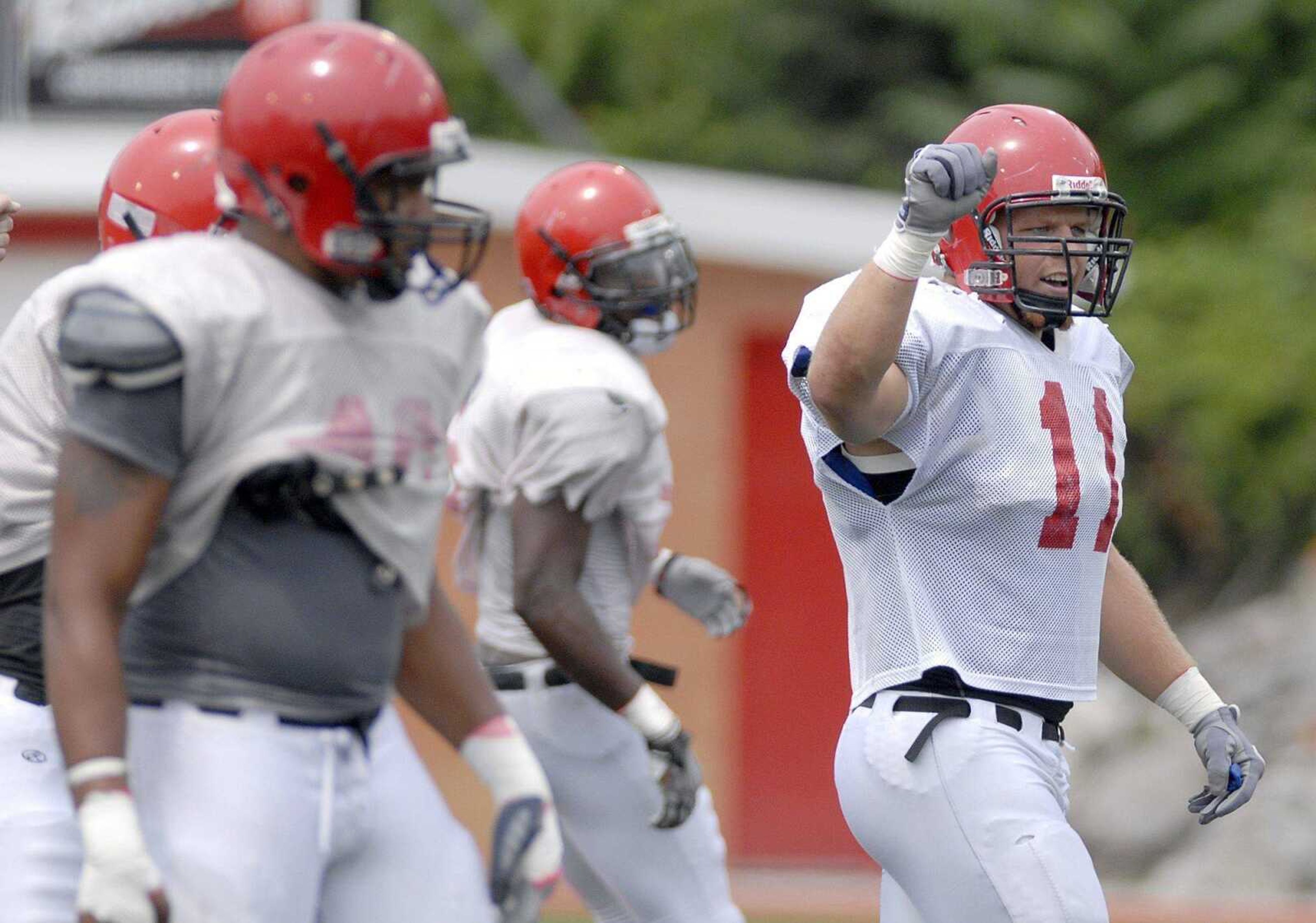 Southeast Missouri State linebacker Blake Peiffer, right, celebrates Saturday during the Redhawks ' scrimmage at Houck Stadium. (Laura Simon)