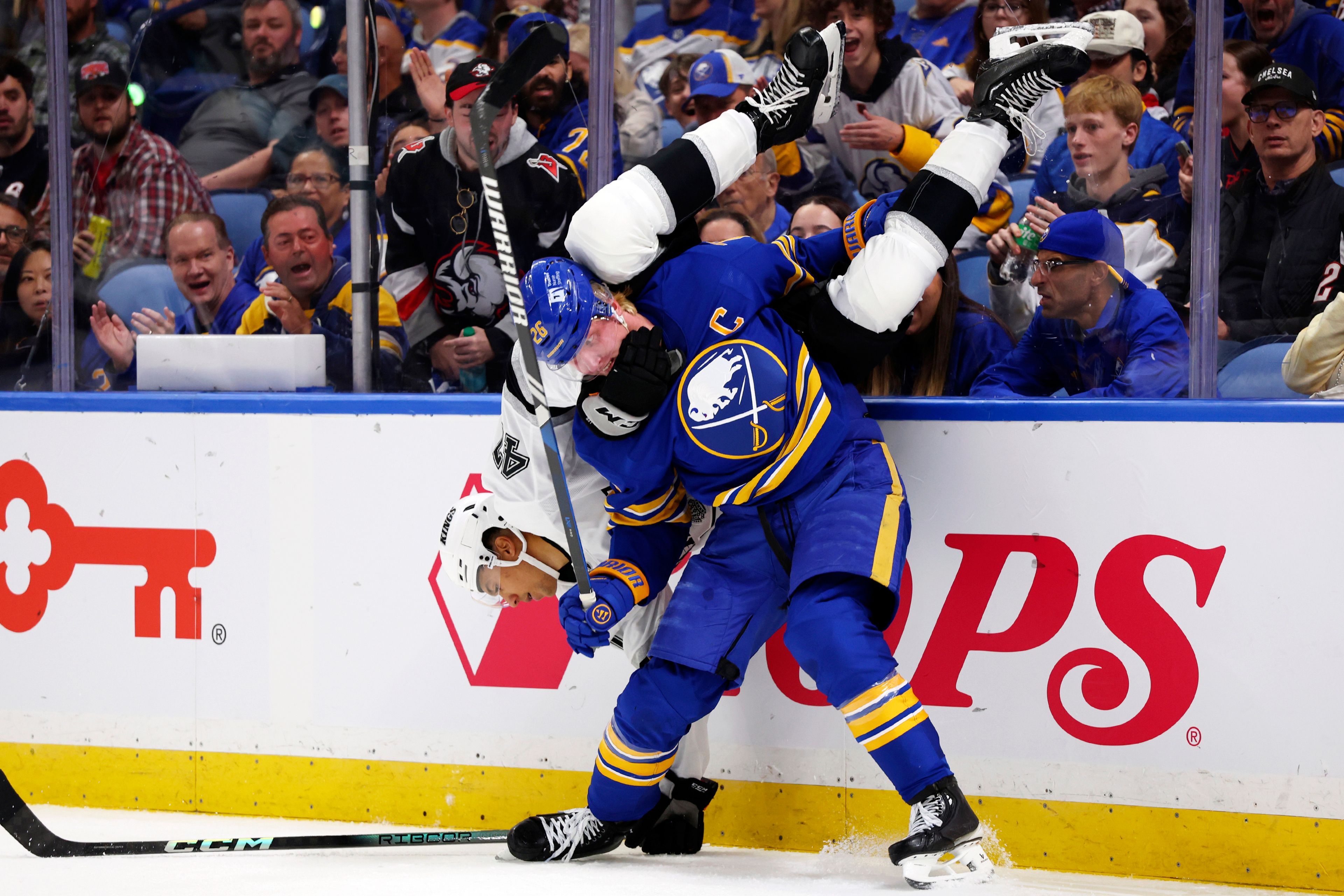 Buffalo Sabres defenseman Rasmus Dahlin (26) checks Los Angeles forward Andre Lee (47) during the second period of an NHL hockey game Thursday, Oct. 10, 2024, in Buffalo, N.Y. (AP Photo/Jeffrey T. Barnes)