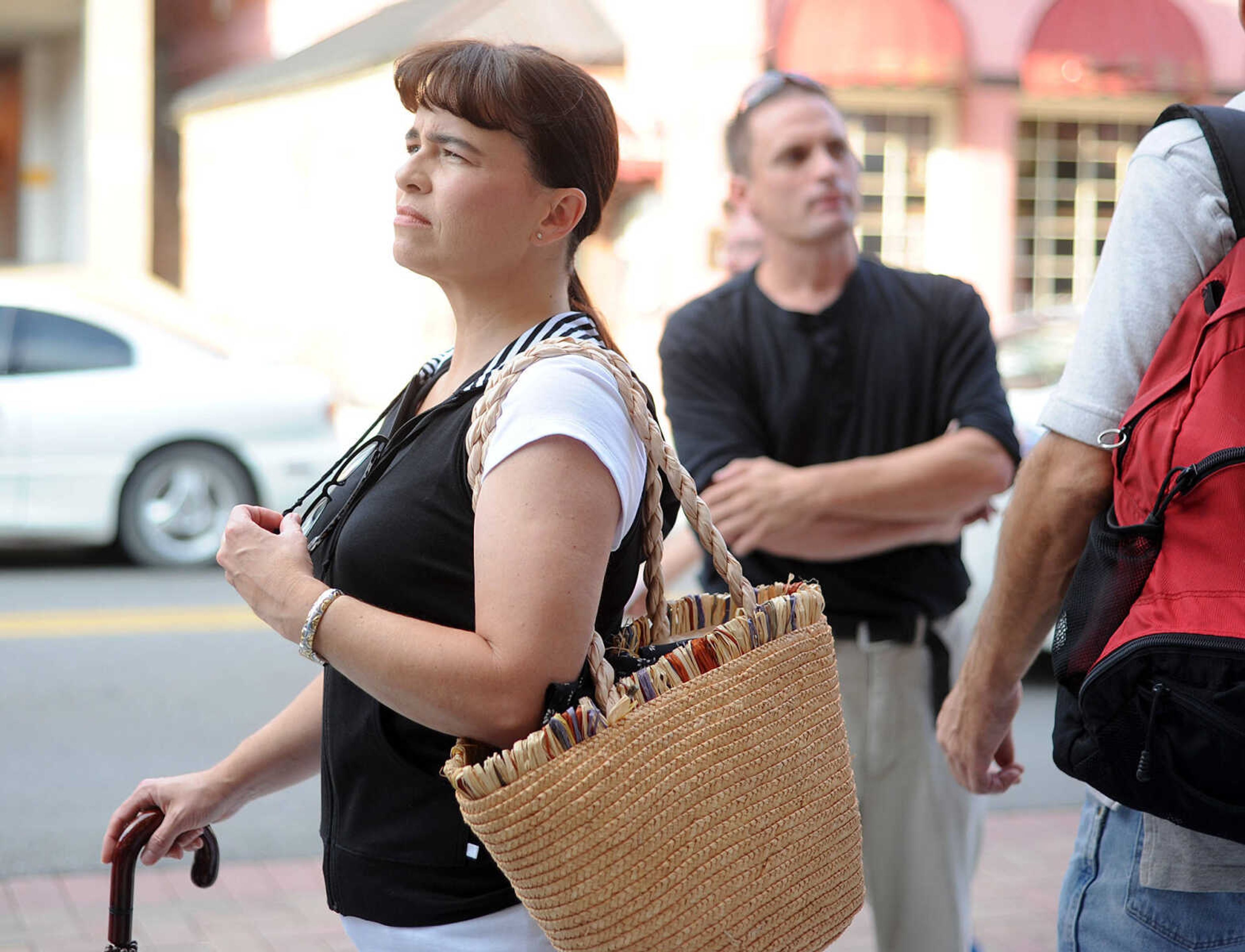 LAURA SIMON ~ lsimon@semissourian.com

Extras for 20th Century Fox's feature film "Gone Girl" line the sidewalk in front of the Southeast Missourian, Thursday, Oct. 3, 2013, in Cape Girardeau.