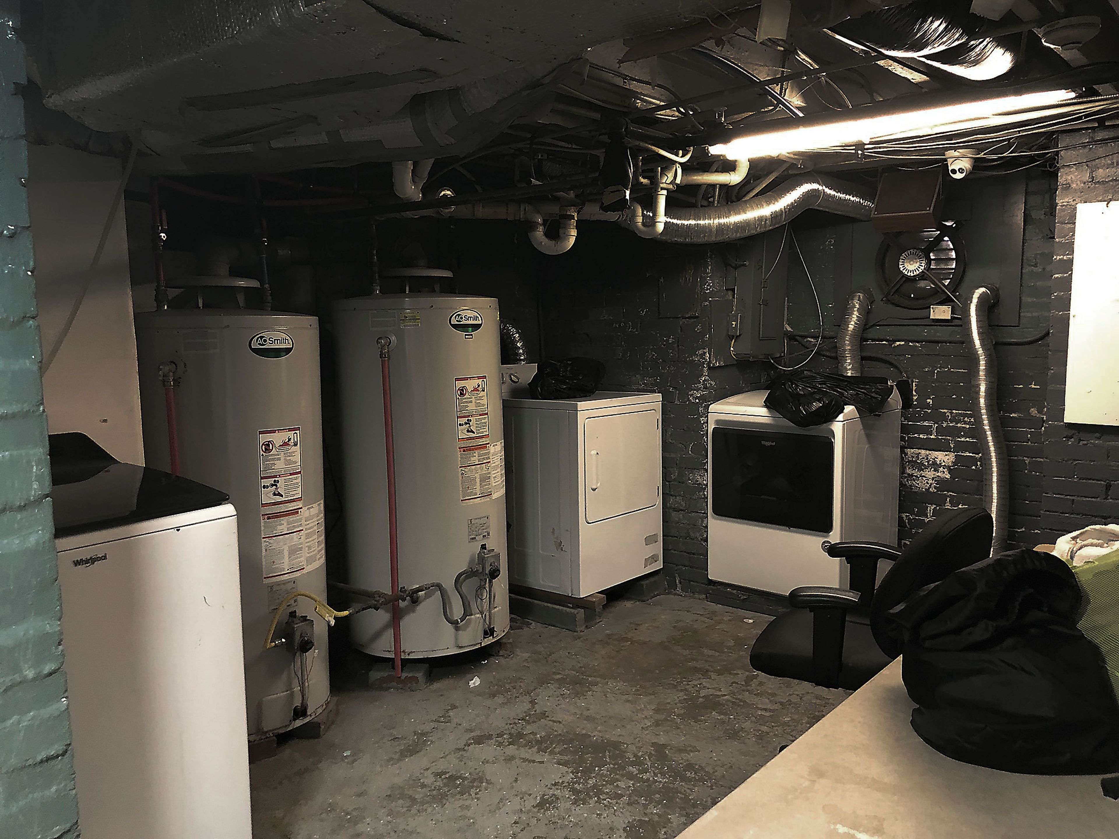 This June 13, 2024 photo shows a laundry area in the basement of the Huntington Addiction Wellness Center, formerly the Huntington Work Release Center where April Youst was assigned as a prisoner in Huntington, W. Va. (AP Photo/Margie Mason)