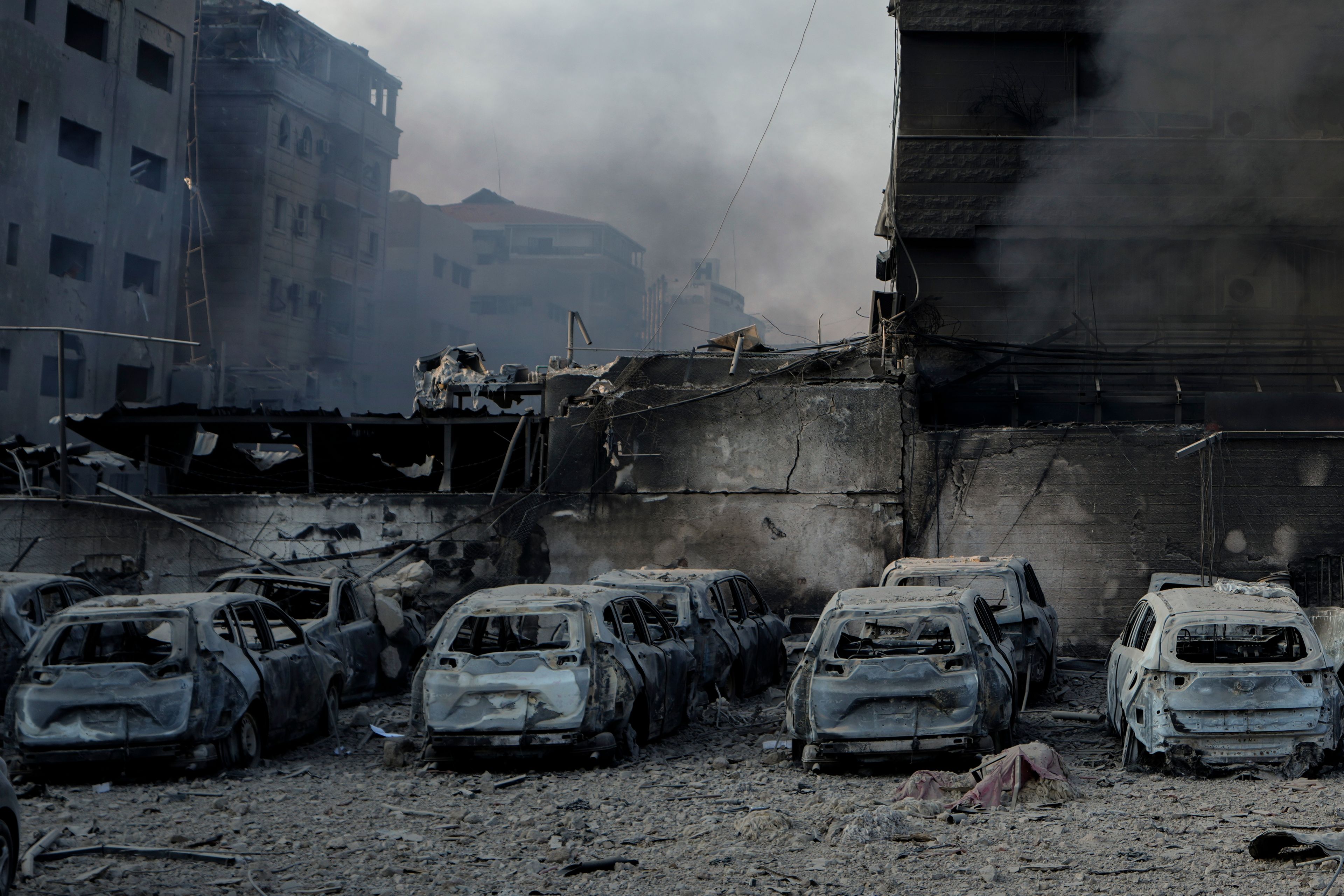 Charred cars at the site of an Israeli airstrike in Dahiyeh, Beirut, Lebanon, Sunday, Oct. 6, 2024. (AP Photo/Bilal Hussein)