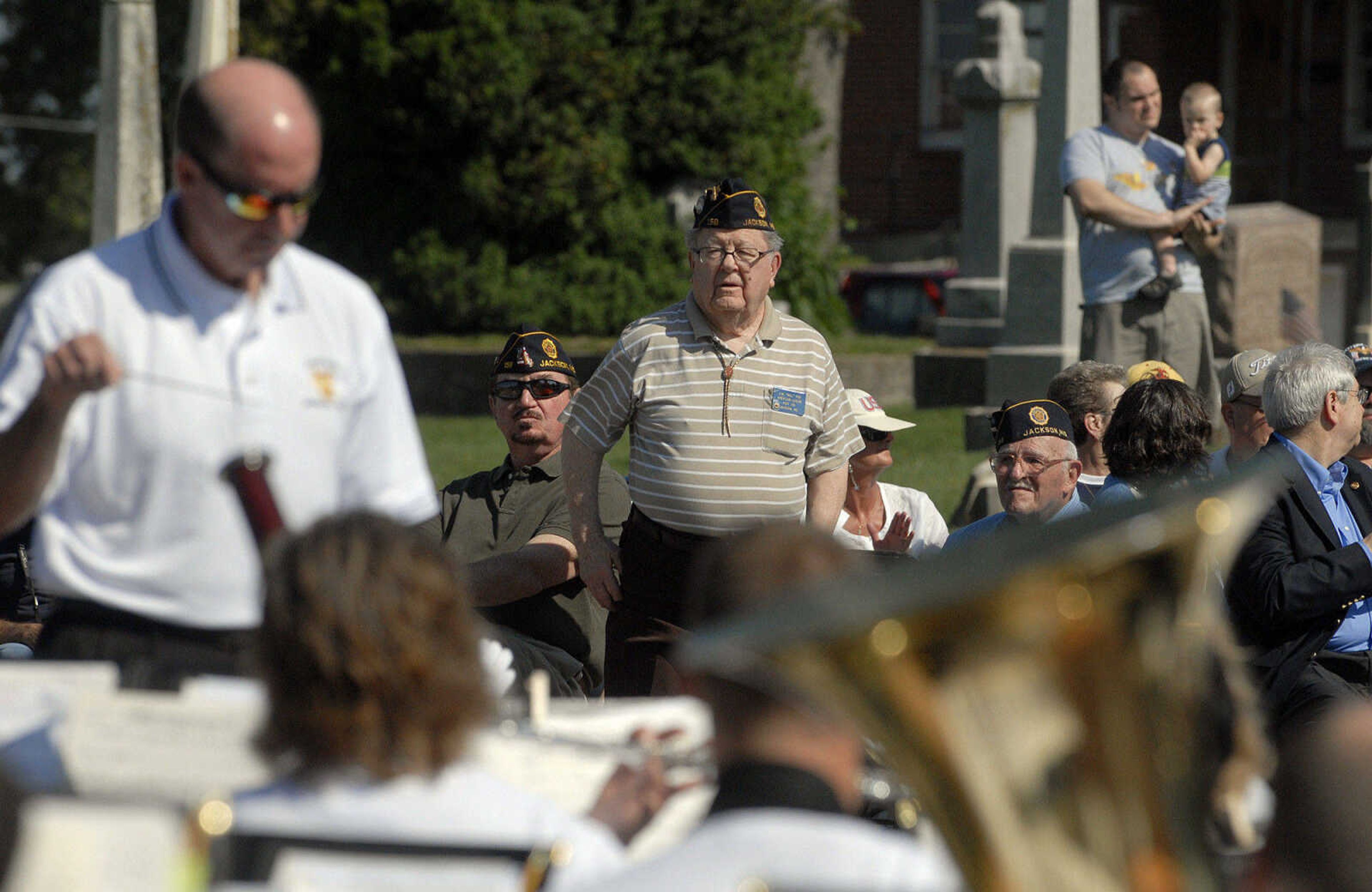 LAURA SIMON~lsimon@semissourian.com
Veterans stand up as the Jackson Municipal Band performs the "Armed Forces Salute" Monday, May 30, 2011 in Jackson.