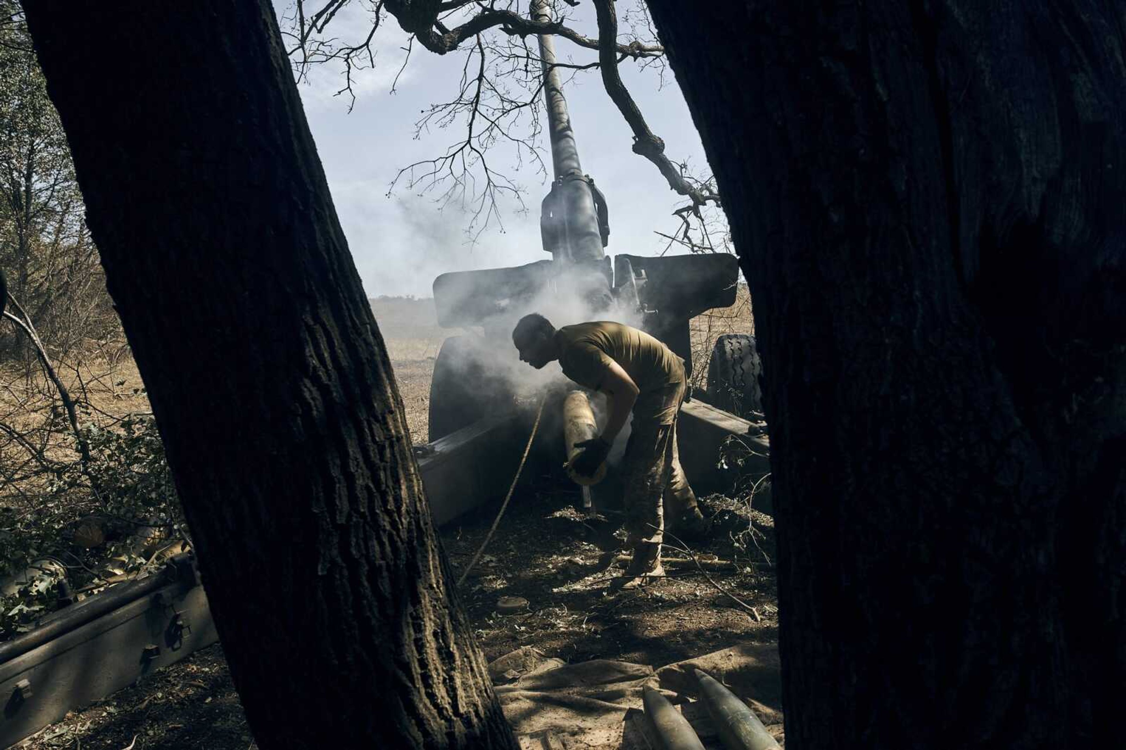 A Ukrainian soldier fires on the front line Saturday in the Donetsk region, eastern Ukraine.