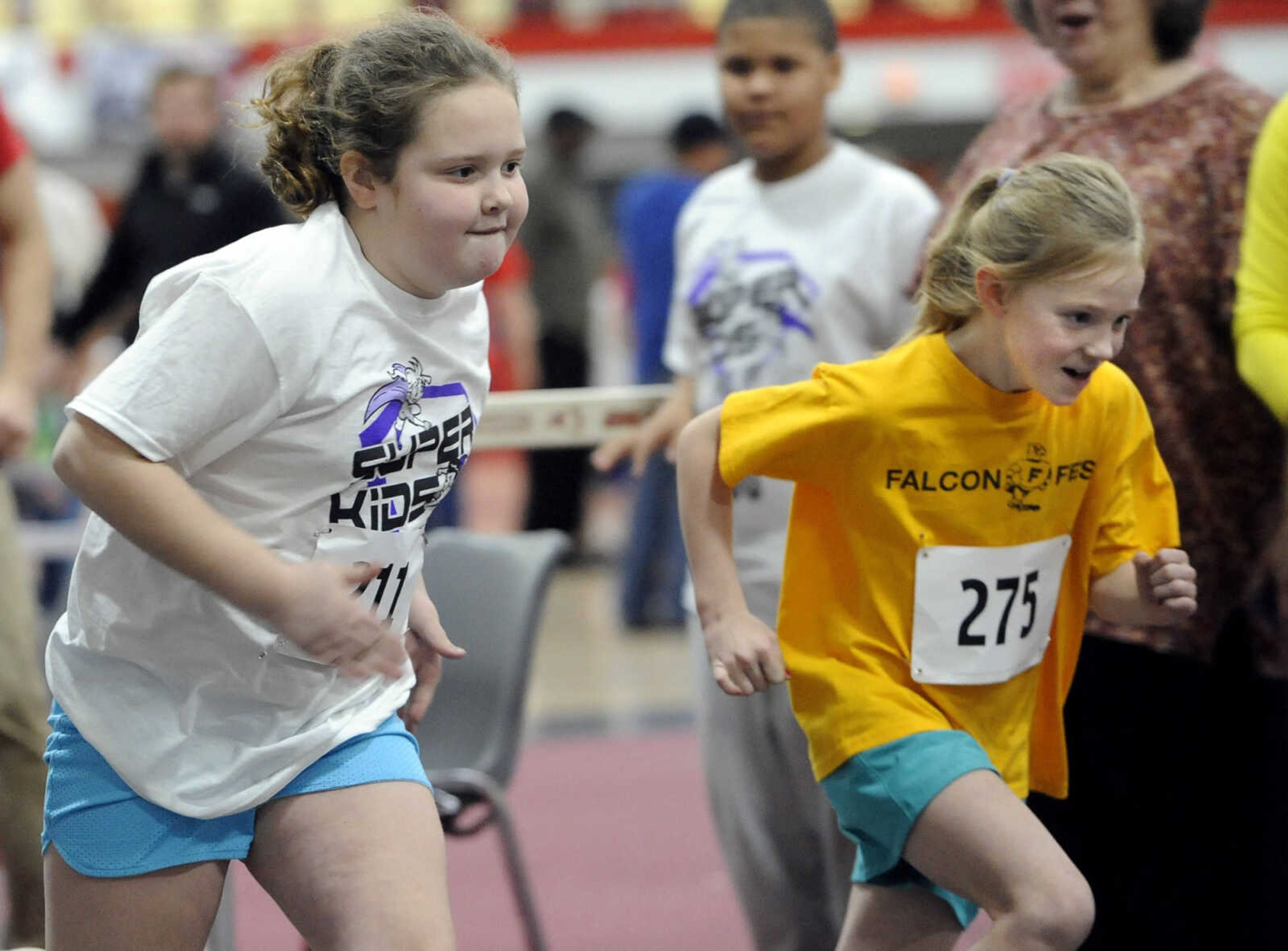 FRED LYNCH ~ flynch@semissourian.com
Morgan Patrick, left, and Audrey Arnold begin a 400-meter run for 7-year-old girls at the Super Kids Race Day on Sunday, Feb. 7, 2016 at the Student Recreation Center.