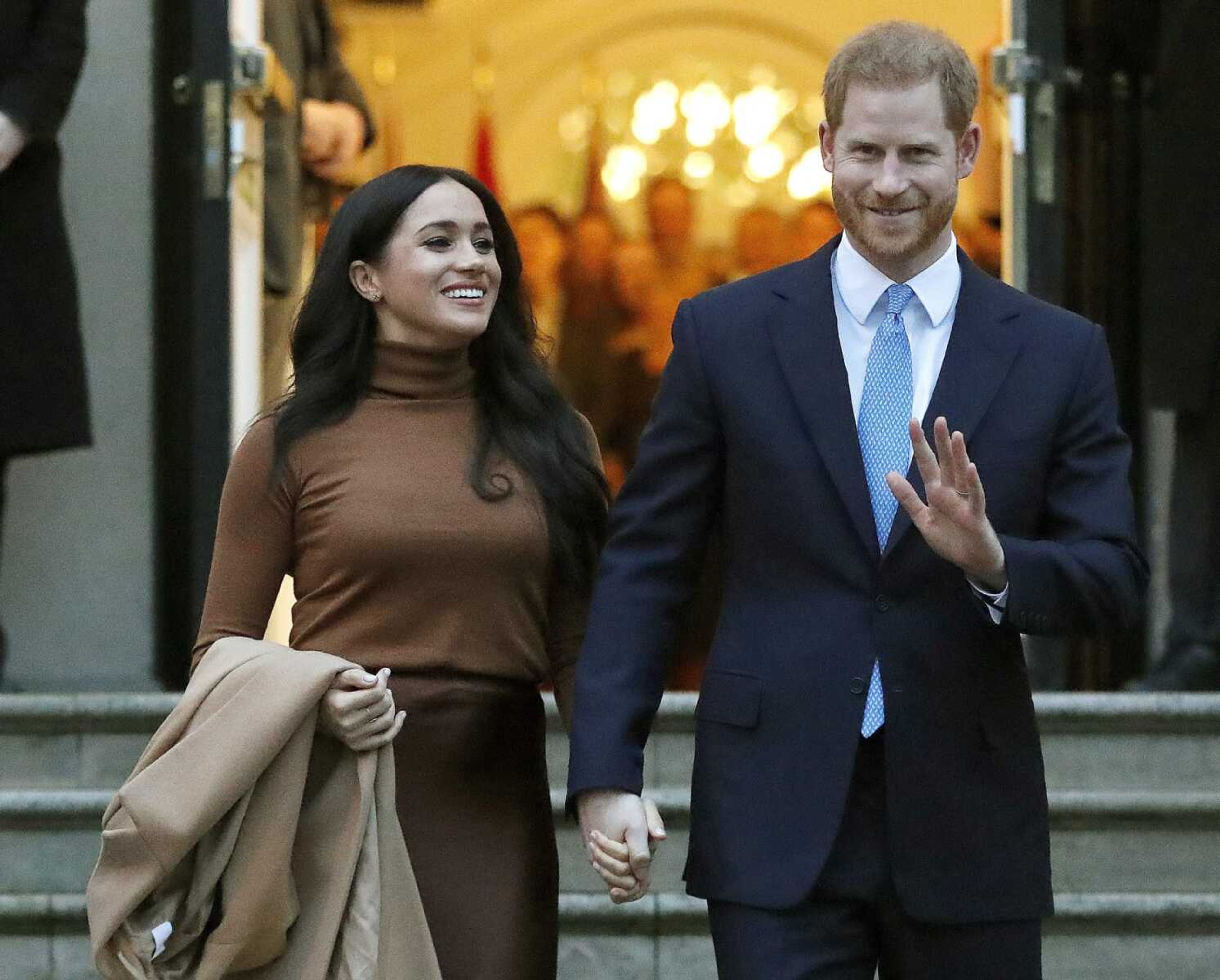 In this  Jan. 7 photo, Britain's Prince Harry and Meghan, Duchess of Sussex leave after visiting Canada House in London. The Duke and Duchess of Sussex say they will no longer cooperate with several British tabloids.