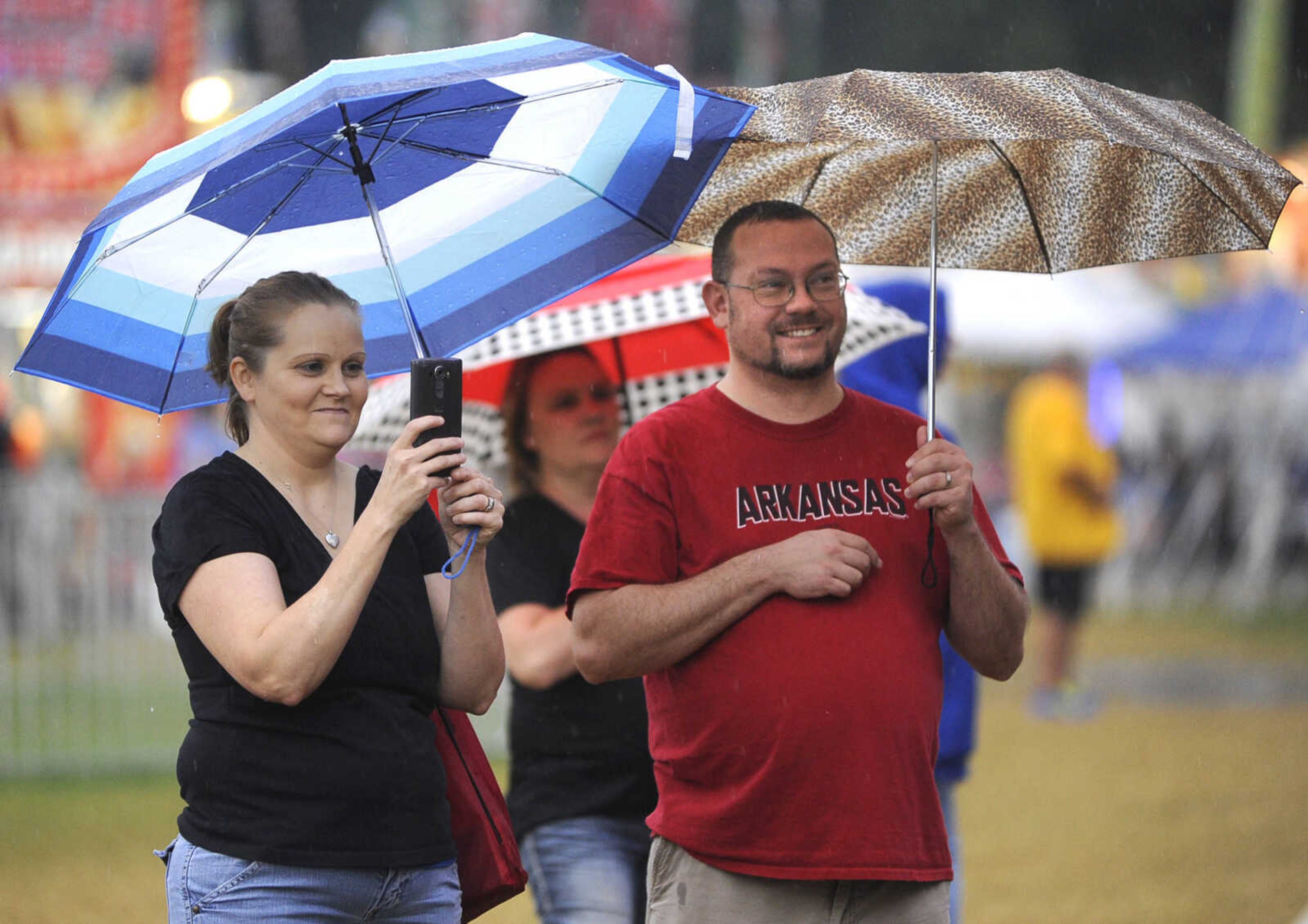 Elizabeth and Matthew Carney of Jackson watch their children exit the Big Bamboo attraction Thursday, Sept. 15, 2016 at the SEMO District Fair in Cape Girardeau.