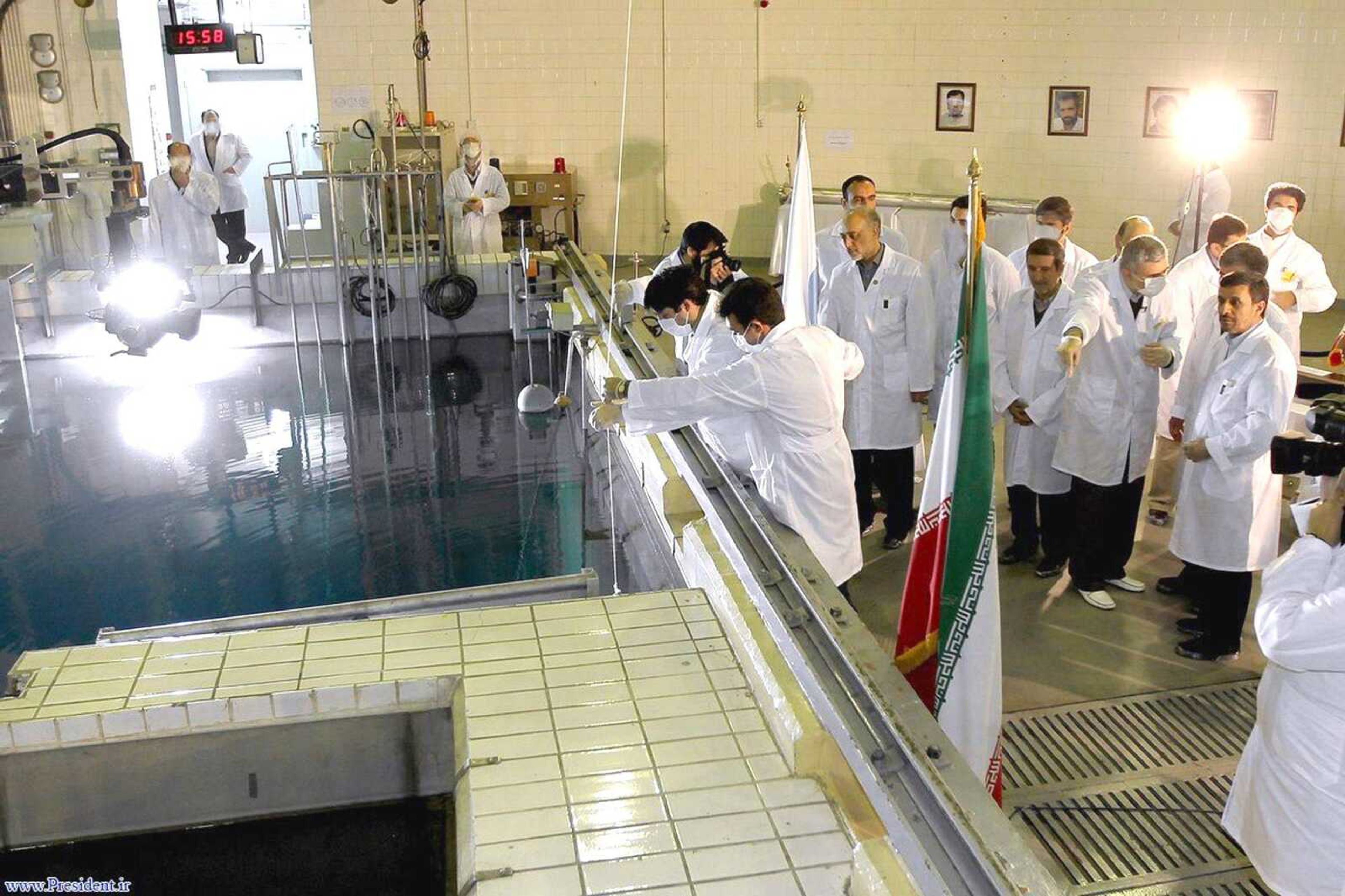 Iranian President Mahmoud Ahmadinejad, right, is escorted by technicians Wednesday during a tour of Tehran&#8217;s research reactor center in northern Tehran, Iran. Iran said Wednesday it is closer to mastering the production of nuclear fuel even as the U.S. weighs tougher pressures and Tehran&#8217;s suspected shadow war with Israel brings probes far beyond the Middle East. (Iranian President&#8217;s Office)