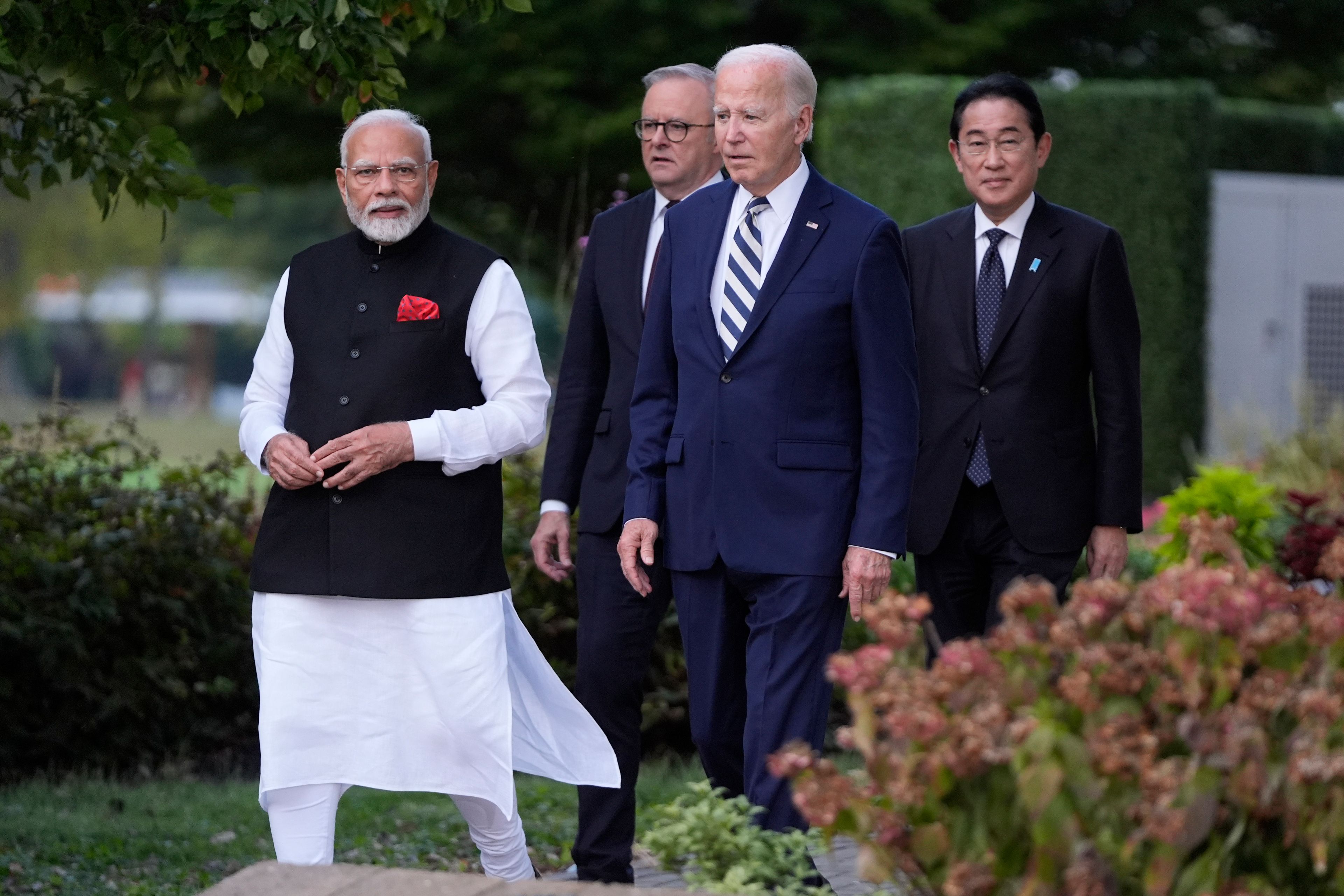 President Joe Biden, joined by Australia's Prime Minister Anthony Albanese, Japan's Prime Minister Fumio Kishida, and India's Prime Minister Narendra Modi, walk out to speak about a Quadrilateral Cancer Moonshot initiative on the sidelines of the Quad leaders summit at Archmere Academy in Claymont, Del., Saturday, Sept. 21, 2024. (AP Photo/Mark Schiefelbein)